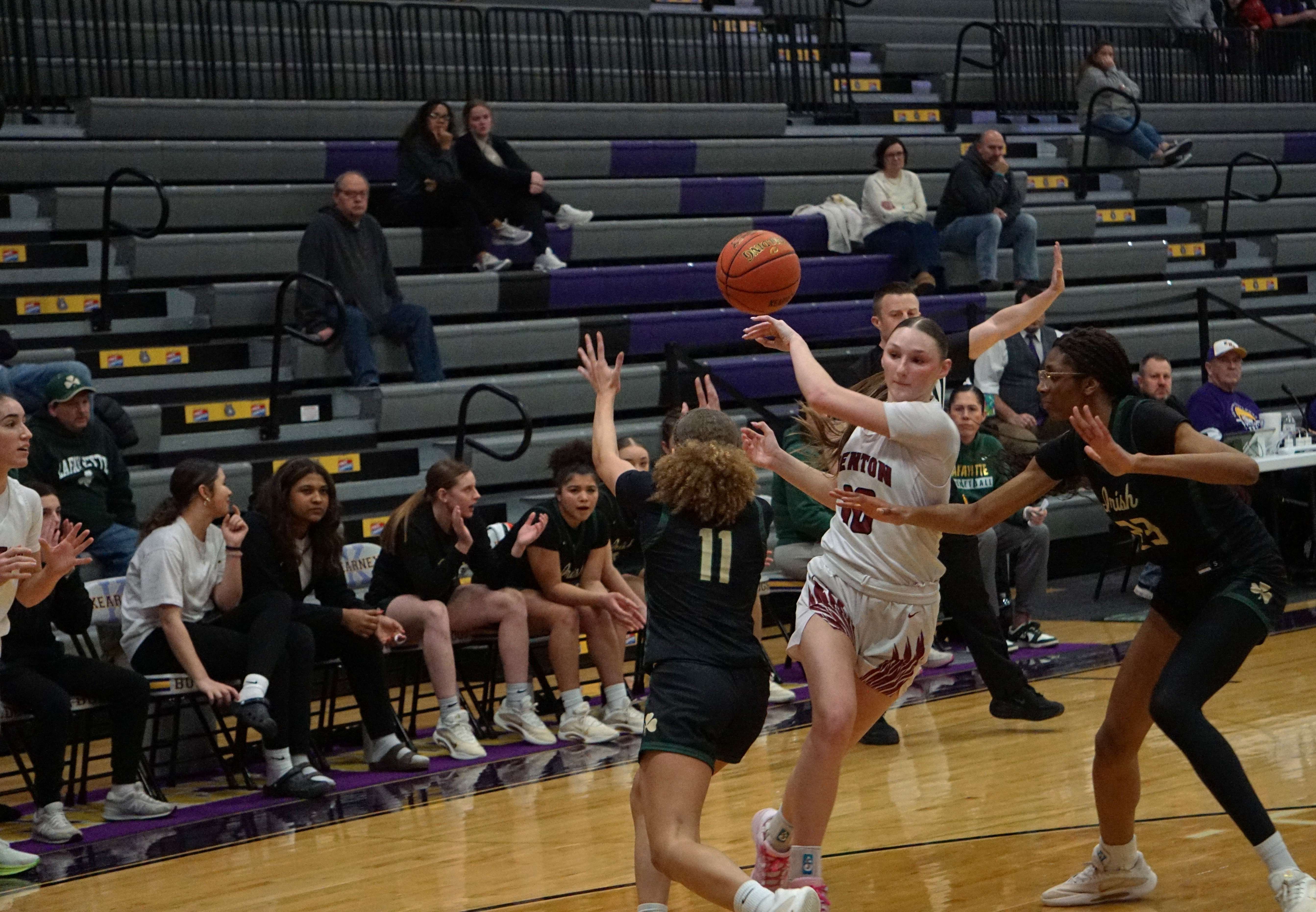 Jalynn Brown (10) drives the paint and does a no look pass out to Eliana Arambula waiting beyond the three point line/Photo by Matt PIke