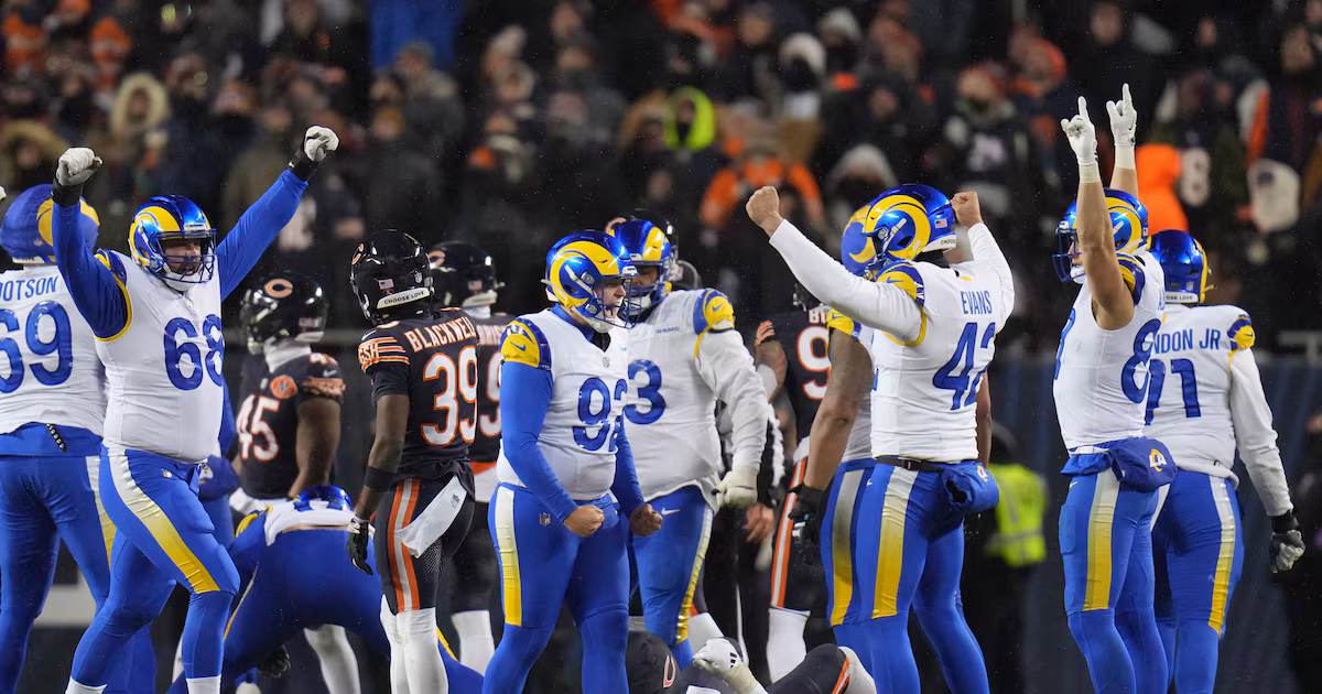 Los Angeles Rams kicker Harrison Mevis, center, reacts with holder Ethan Evans, center right, and teammates after booting a game-winning field goal during overtime of an NFL football divisional playoff game against the Chicago Bears, Sunday, Jan. 18, 2026, in Chicago. (AP Photo/Jeff Roberson)
