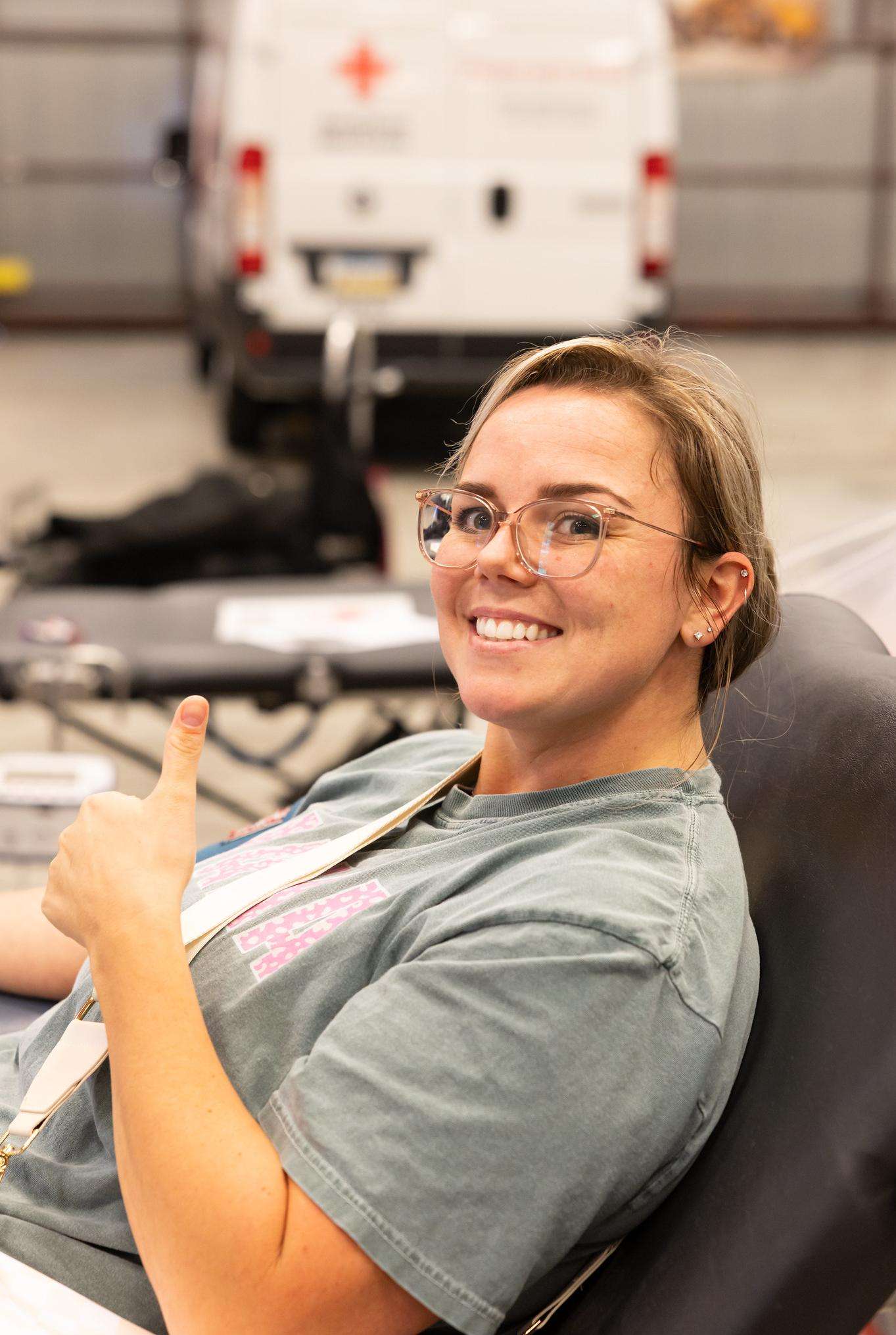 A blood donor pauses for a photo on the Barton campus at a previous blood drive.