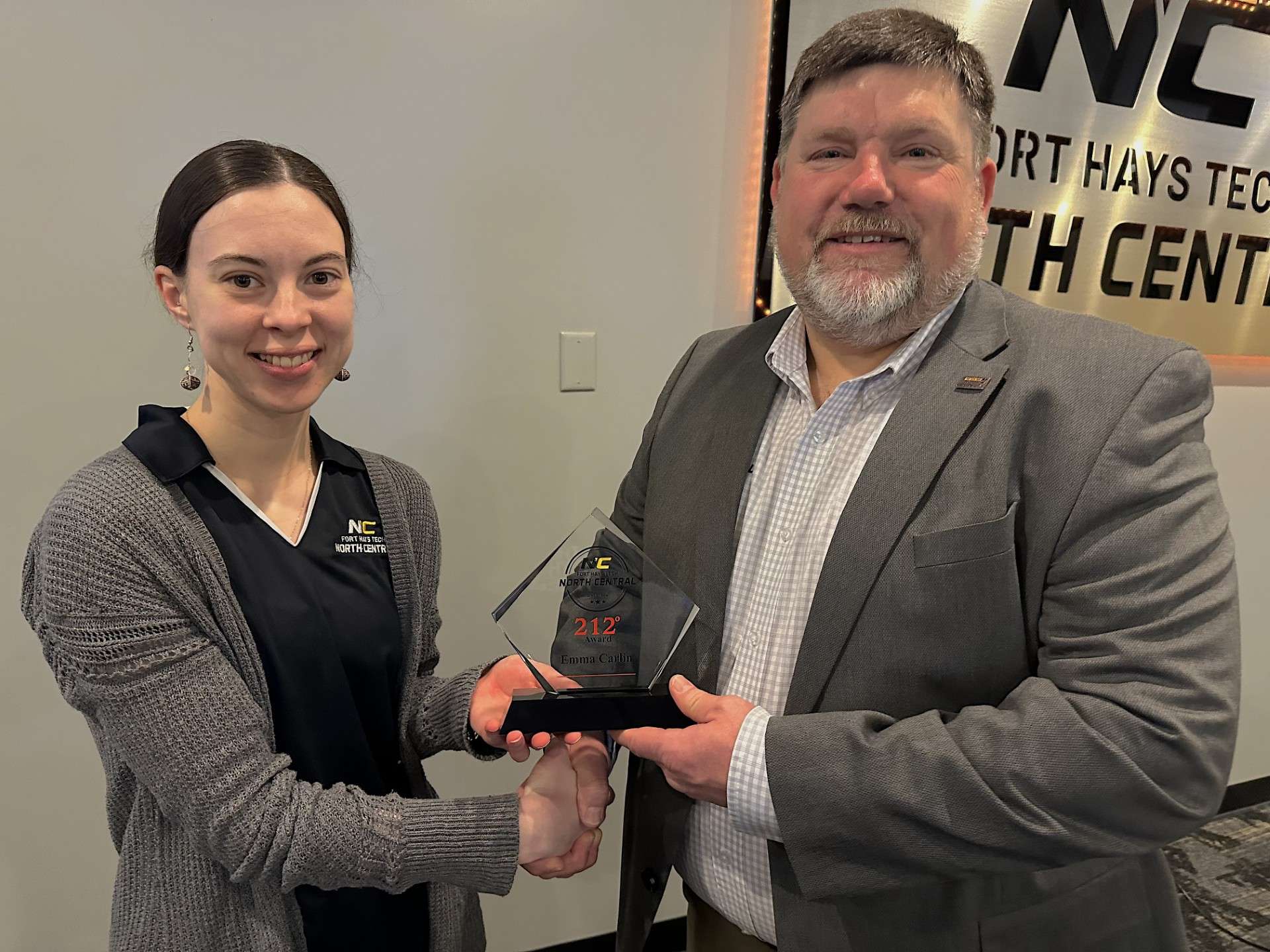Emma Carlin,&nbsp;212° Award winner, with Eric Burks,&nbsp;Fort Hays Tech | North Central president. Courtesy photo