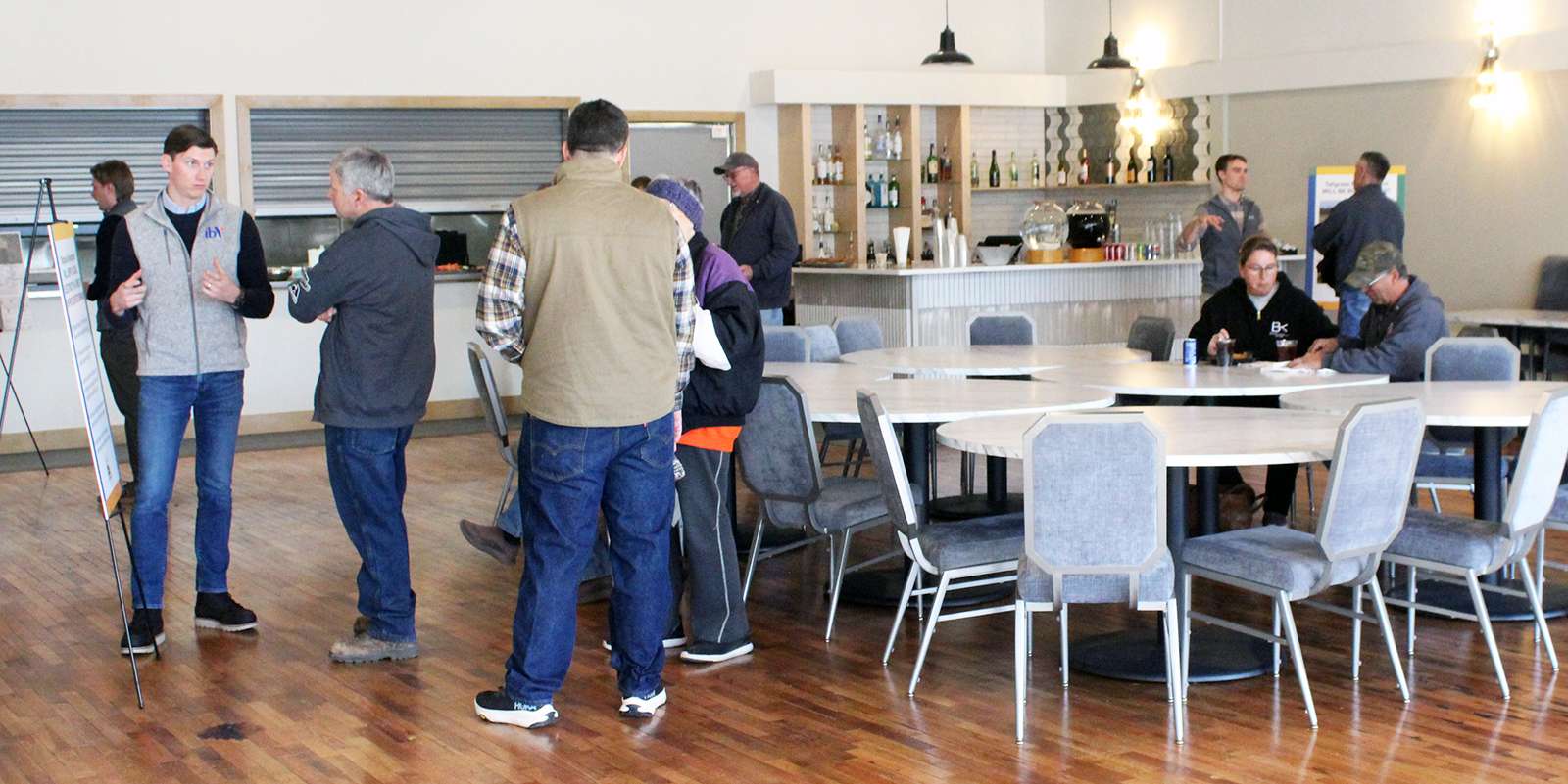 IbV representatives answer residents' questions about a proposed solar facility to be located in southwest Ellis County during an open house on Thursday in Hays. Photo by Cristina Janney/Hays Post