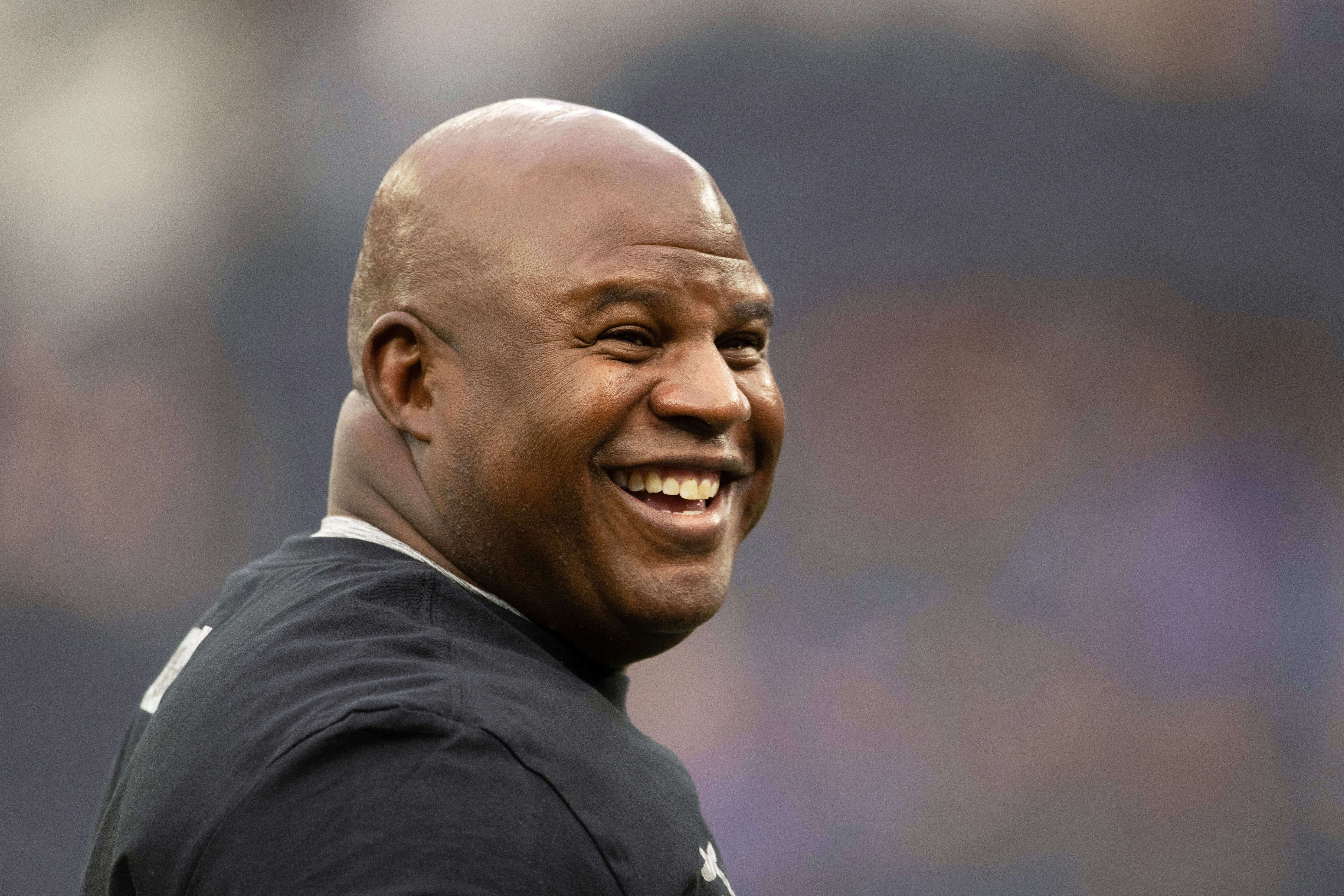 FILE - Washington Commanders offensive coordinator Eric Bieniemy smiles before an NFL football game against the Los Angeles Rams, Dec. 17, 2023, in Inglewood, Calif. (AP Photo/Kyusung Gong, File)