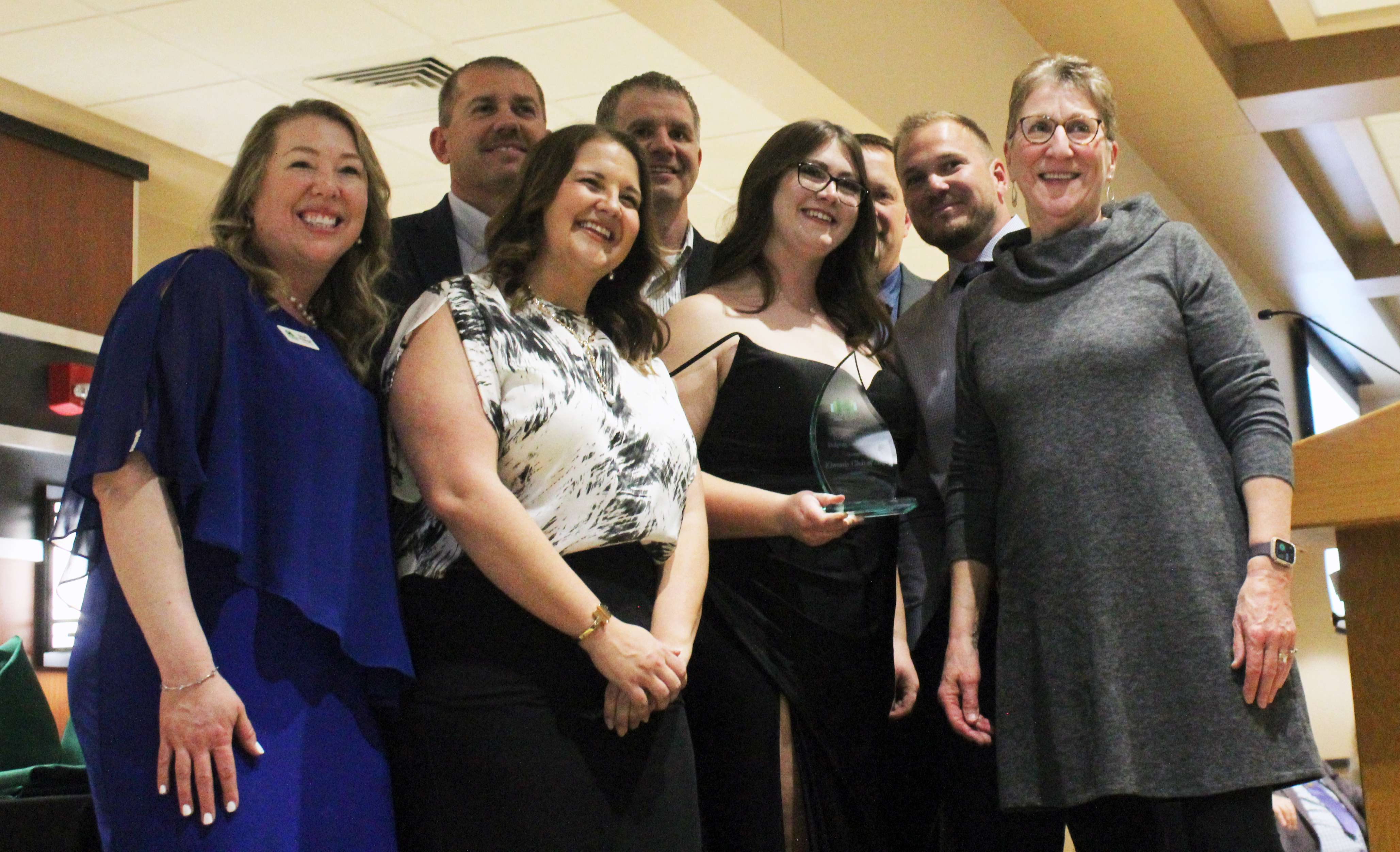 Leadership from the Kiwanis accepts the&nbsp;Commerce Bank Helping Hands Award. Photo by Cristina Janney/Hays Post.