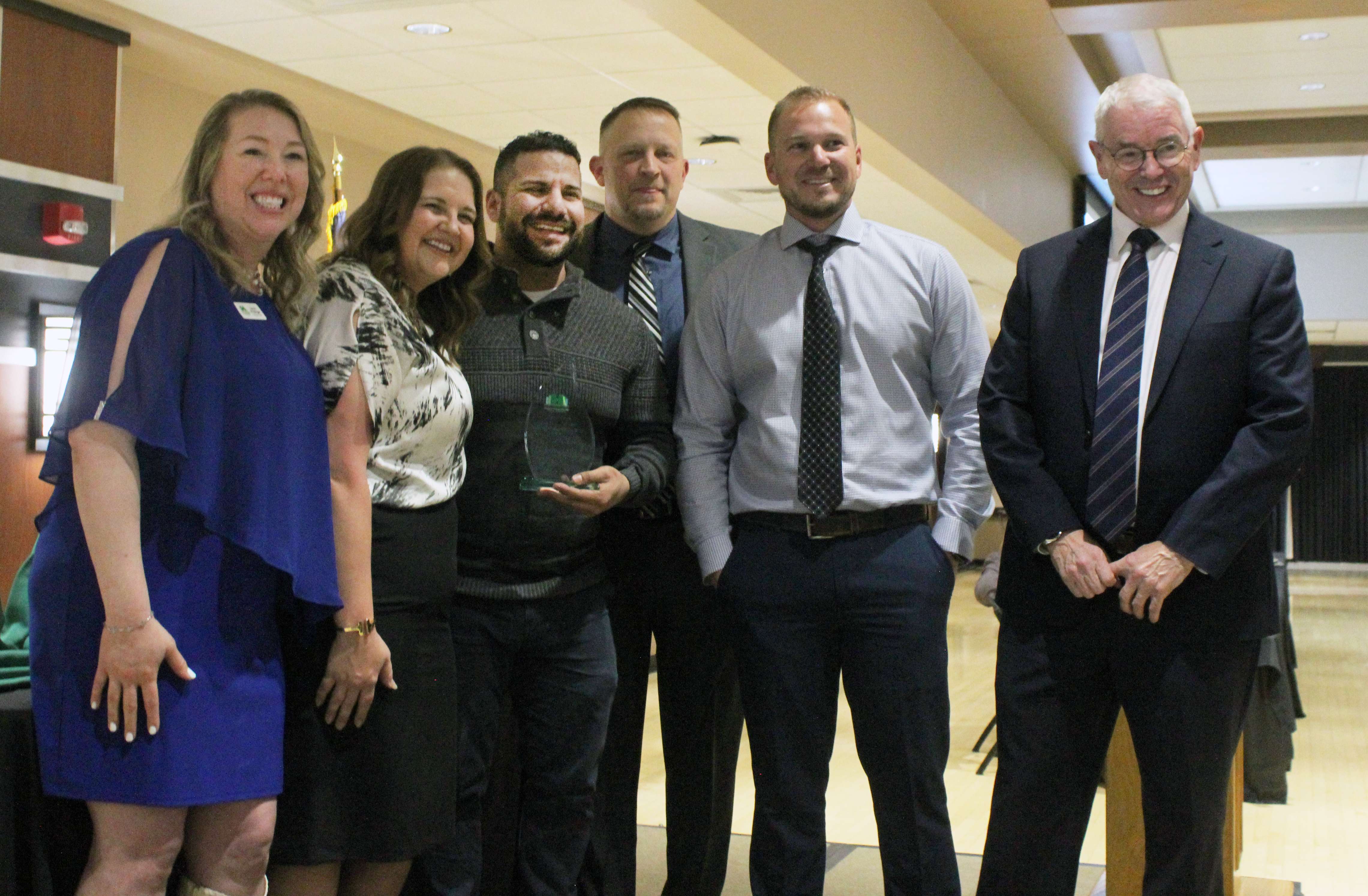 Israel Luna, accepts the&nbsp;Grow Hays Robert E. Schmidt Entrepreneur of the Year Award.&nbsp;Photo by Cristina Janney/Hays Post
