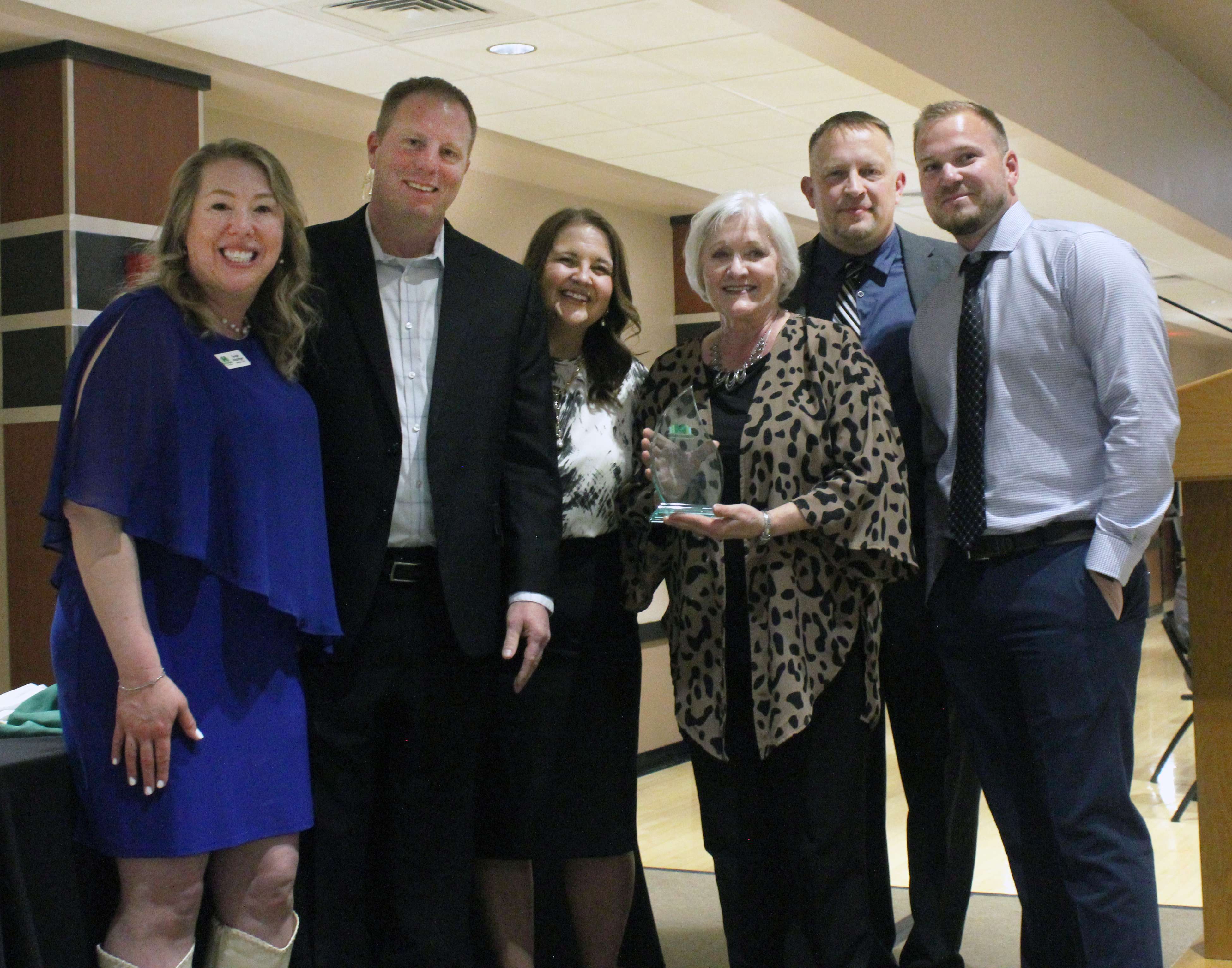 Clare Gustin accepts the&nbsp;Golden Belt Bank Hall of Fame Award.&nbsp;Photo by Cristina Janney/Hays Post