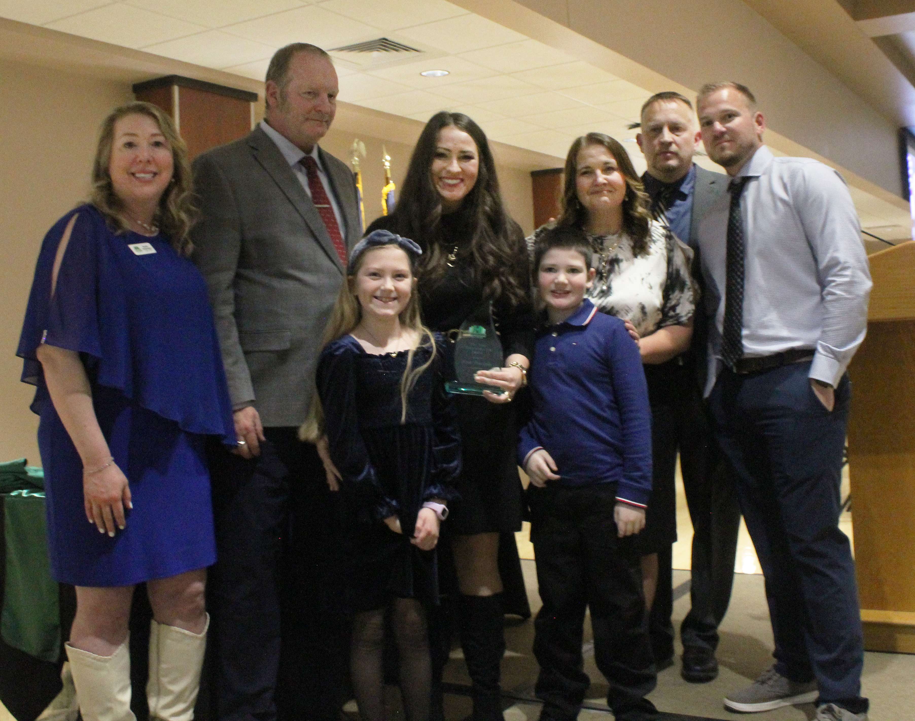 Beth Heimann and her children accept the Citizen of the Year Award on behalf of their husband and father, Hays Police Sgt. Scott Heimann, who was killed in the line of duty in 2025.&nbsp;Photo by Cristina Janney/Hays Post
