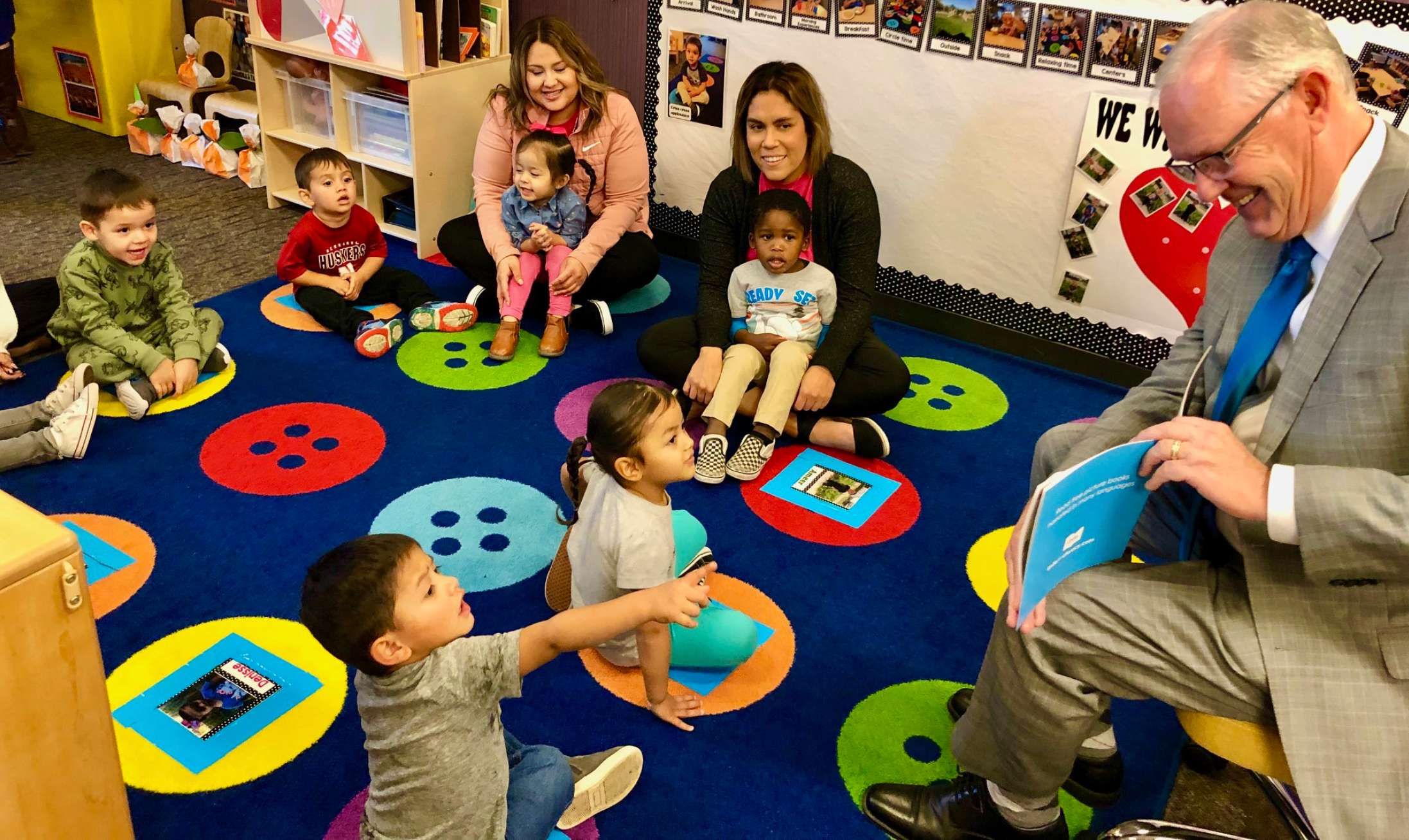 Brian Maher, Nebraska’s education commissioner, reads a book to a group of mostly 3-year-olds Monday as he and others launch a statewide project to boost reading skills of pre-kindergarteners. The kickoff was at an Educare of Omaha at Indian Hill, 3110 W St., on Oct. 30, 2023. (Cindy Gonzalez/Nebraska Examiner)