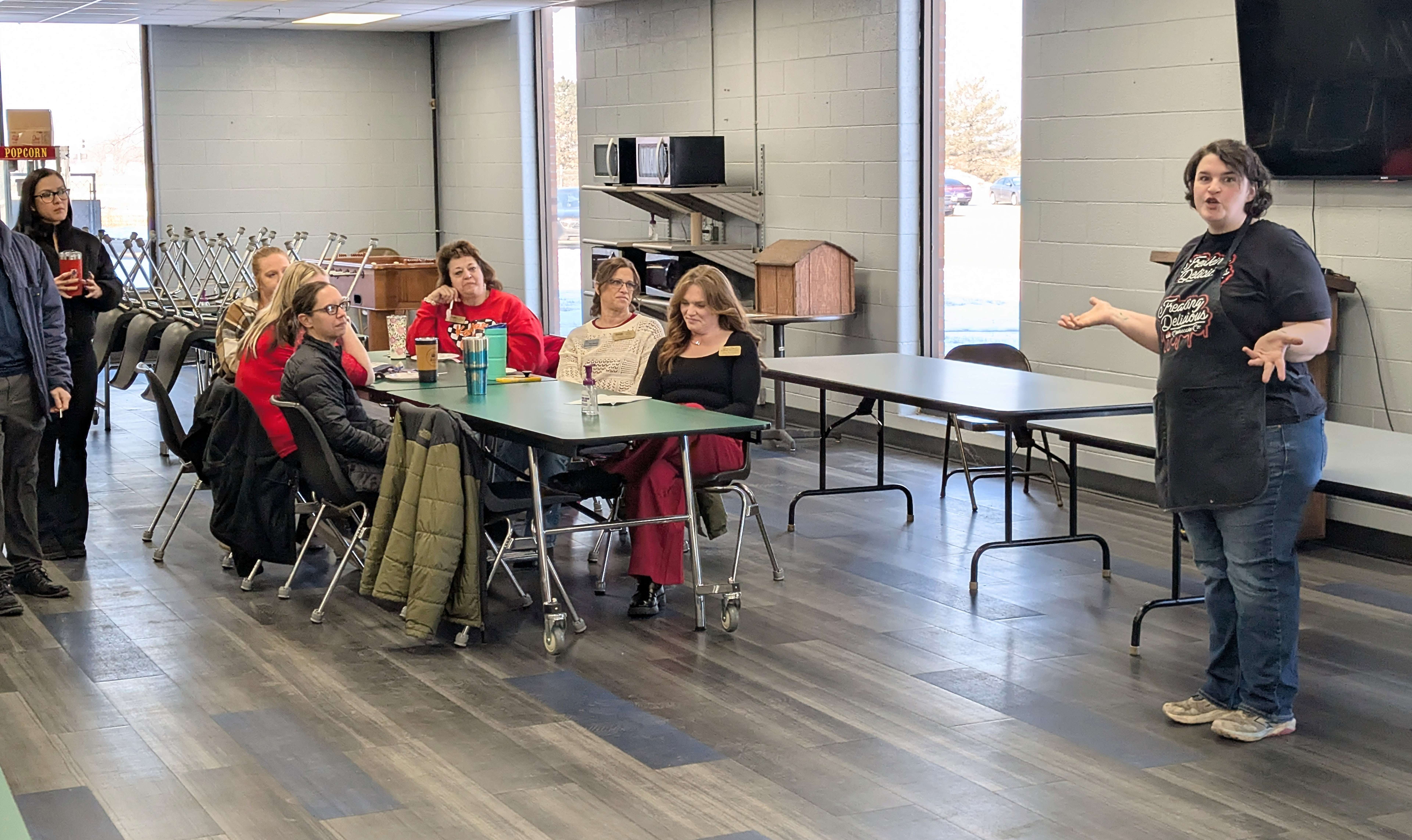 Allie Cartwright, owner of Freaking Delicious Cheesecake, discusses her expansion and move to the commercial kitchen at Fuller Industries Inc. during a Great Bend Chamber of Commerce coffee Thursday morning at Fuller.