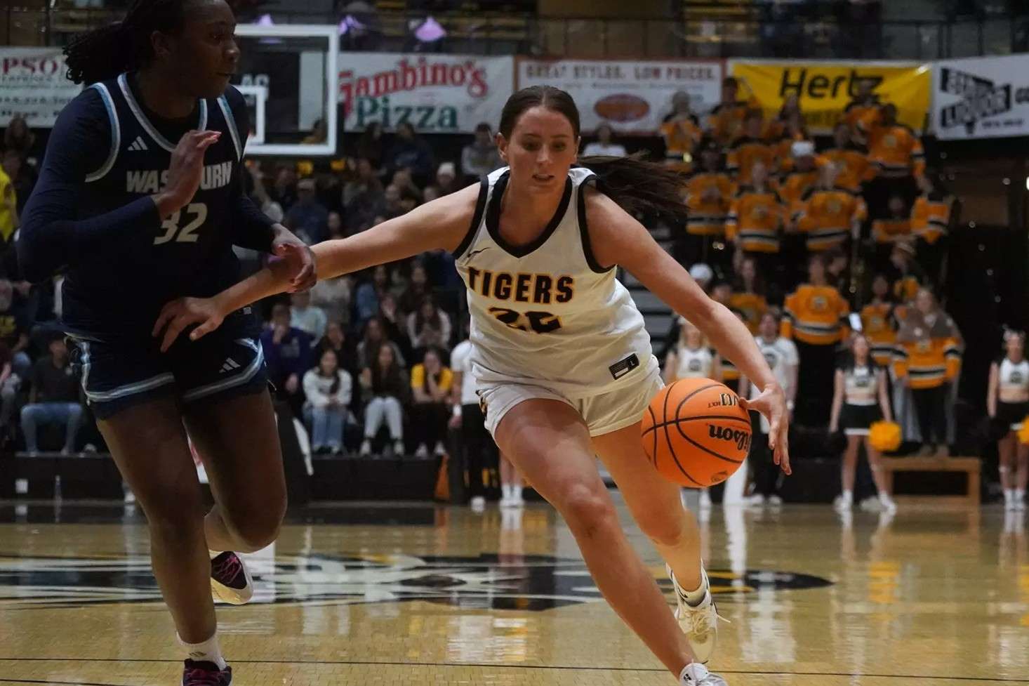 Fort Hays State's Talexa Weeter (22) brings the ball up the floor against Washburn's Yibari Nwidadah (32) in the second half Thursday, January 29, 2026 in Hays, Kan. (FHSU Athletics photo/Gillian Lynch)
