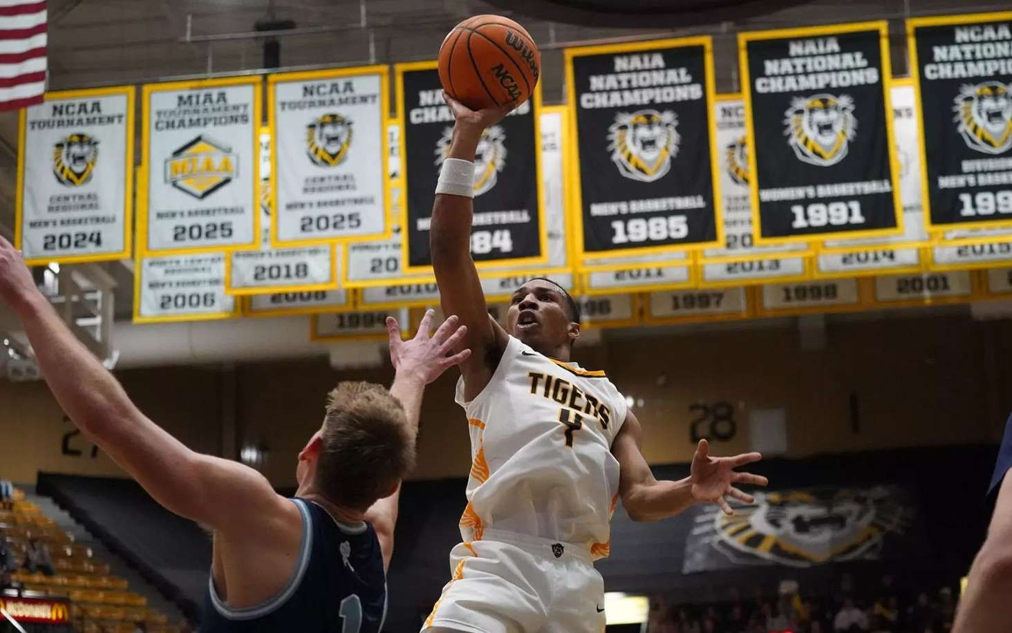 Fort Hays State's Jahvari Martino (4) attempts a shot over Washburn's Brady Christiansen (1) in the second half of their game on Thursday, Januaryu 29, 2026 in Hays Kan. (FHSU Athletics photo/GIllian Lynch)