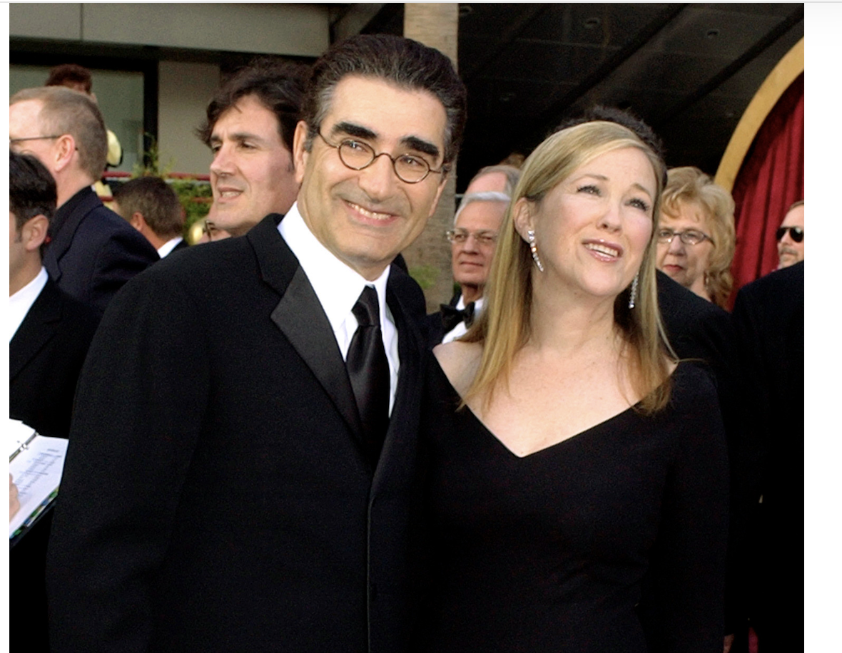 FILE - Eugene Levy, left, and Catherine O'Hara appear at the 76th annual Academy Awards in Los Angeles. on Feb. 29, 2004. (AP Photo/Laura Rauch, File)