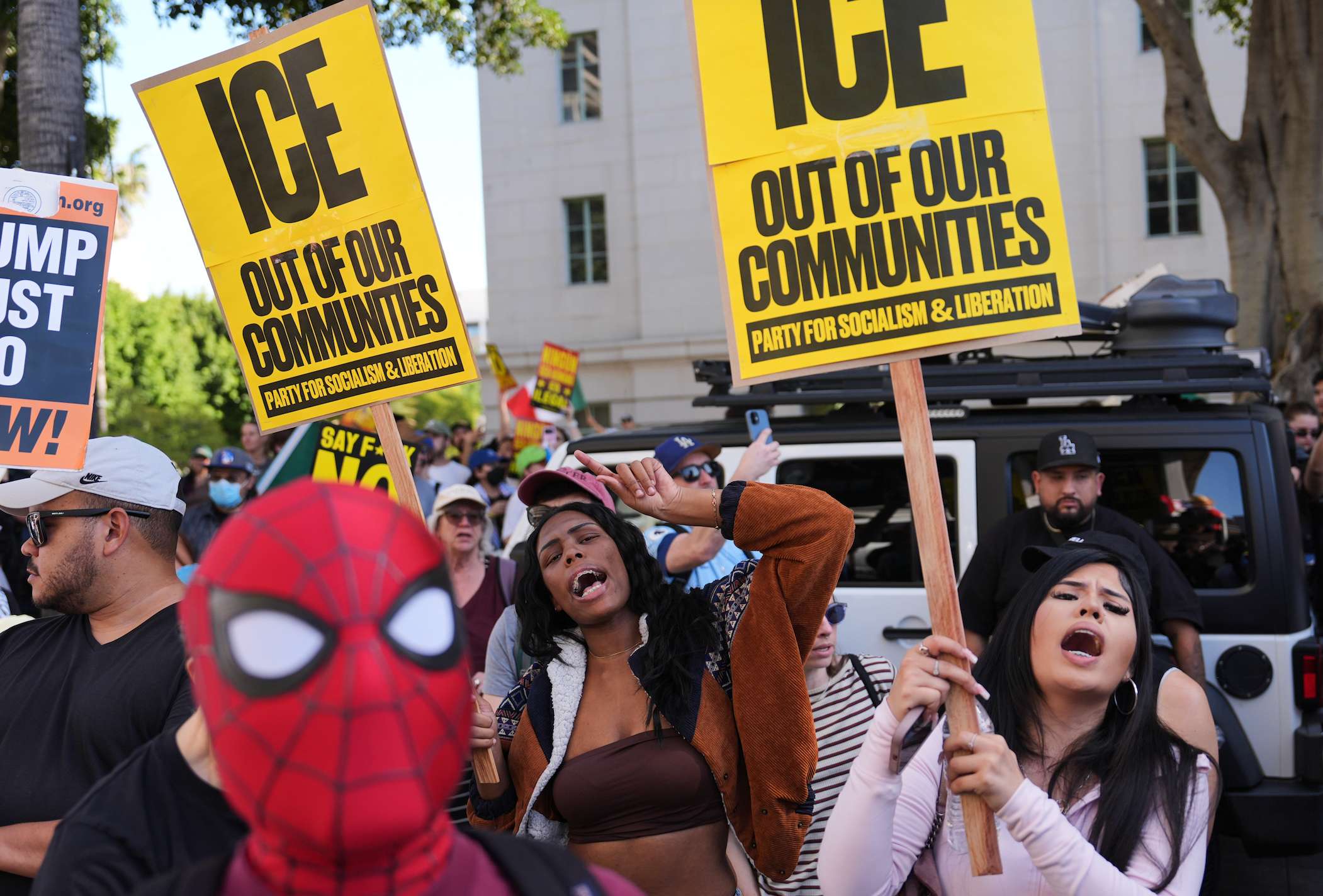 People gather during a protest on Friday, Jan. 30, 2026, in Los Angeles. (AP Photo/Jae C. Hong)