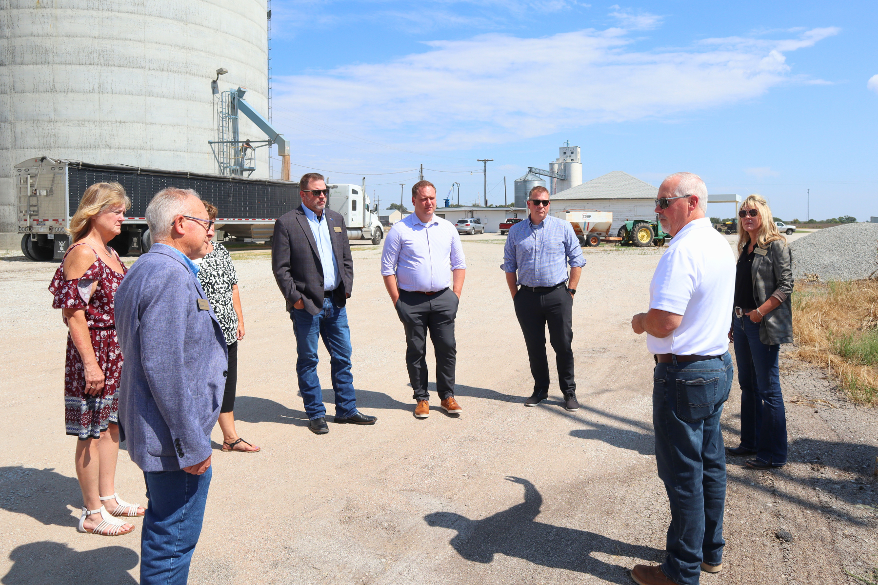 Barton County Commissioners, Administrator and Counselor visit with Mike Corbus of Central Prairie Co-op in Claflin during the Travel 389 tour, discussing local industry and community needs.