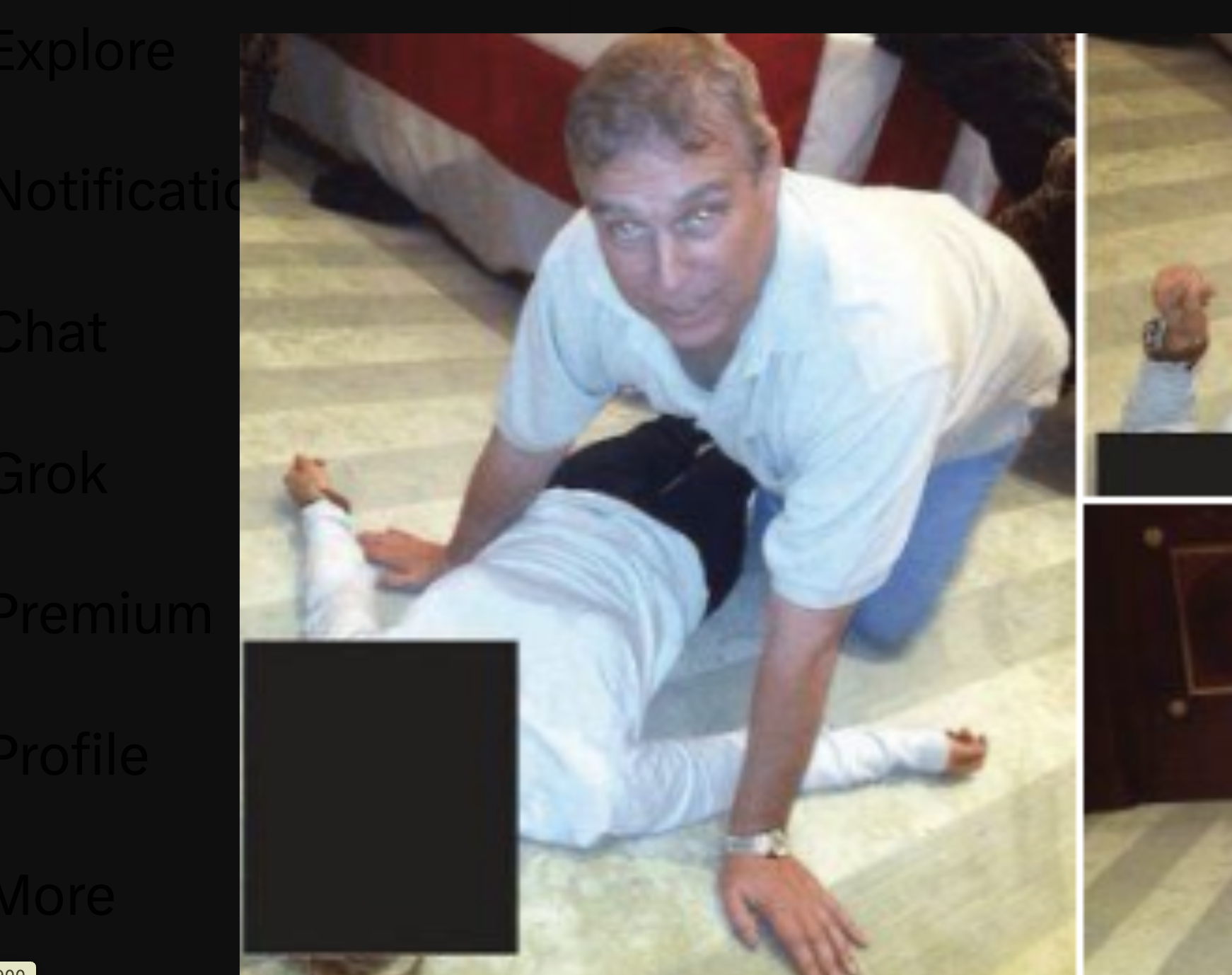 EDS NOTE: GRAPHIC CONTENT - Image from an undated and redacted document released by the U.S. Department of Justice, showa Andrew Mountbatten-Windsor, formerly known as Prince Andrew, leaning over an unidentified person.