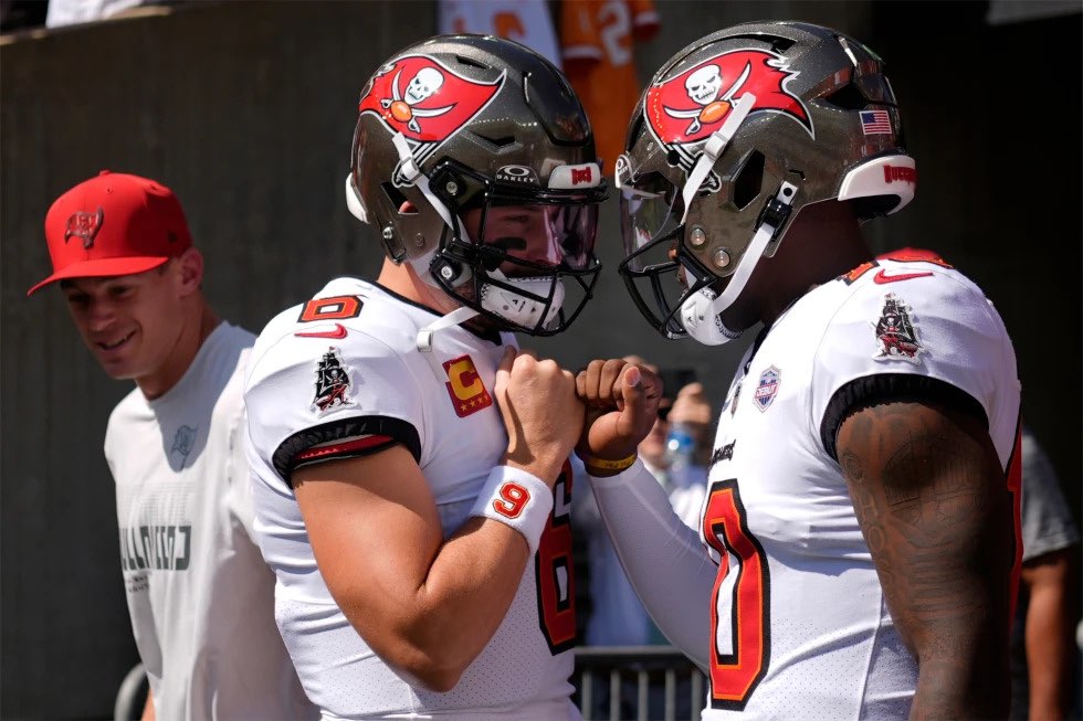 Tampa Bay Buccaneers quarterbacks Baker Mayfield (6) and Jalon Daniels (10) enter the field to warm up before an NFL football game against the Cincinnati Bengals Sunday, Sept. 13, 2026, in Cincinnati. (AP Photo/Carolyn Kaster)