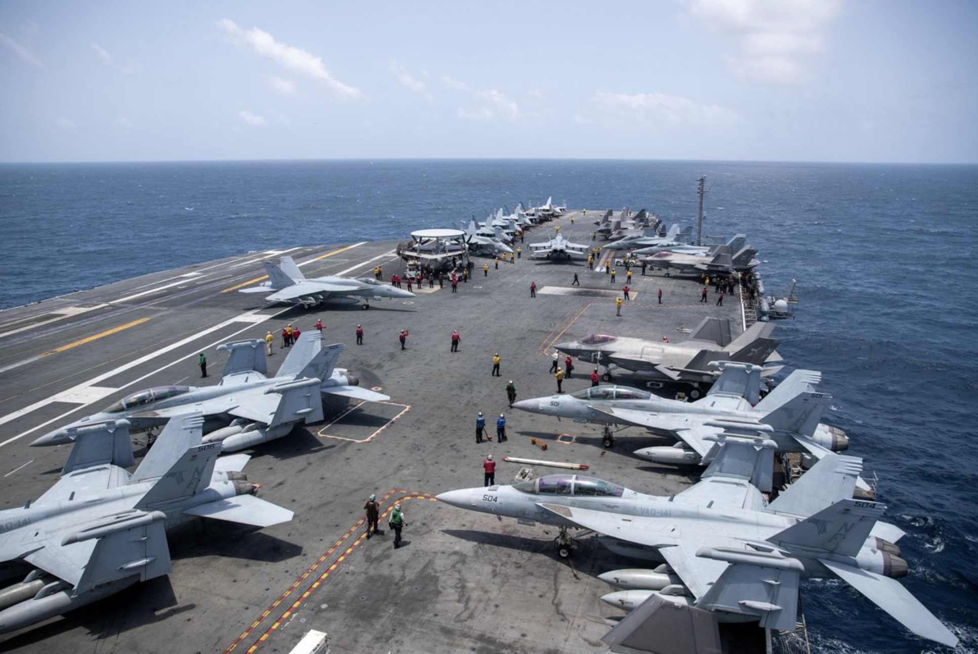 File photo-U.S. Sailors work on the flight deck of USS George Washington (CVN 73), Aug. 20, as the aircraft carrier transits the Arabian Sea.&nbsp;The George Washington Carrier Strike Group is operating in Middle East-photo U.S. Central Command