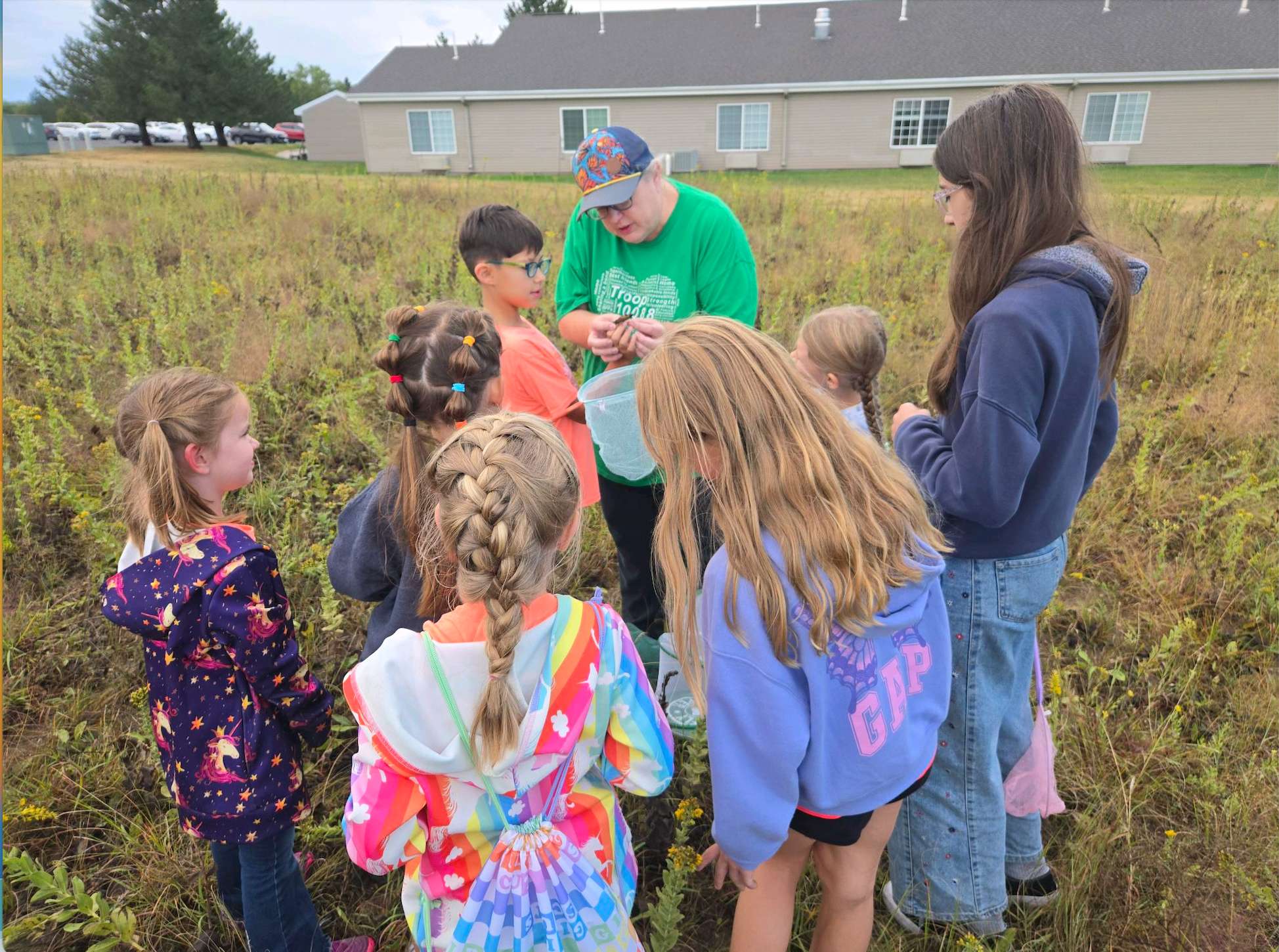 Cristina Janney, center back, helps local Girl Scouts tag monarch butterflies at the Sternberg Museum of Natural History nature trail on Saturday. The tagging is part of The University of Kansas' Monarch Watch program. Courtesy photo