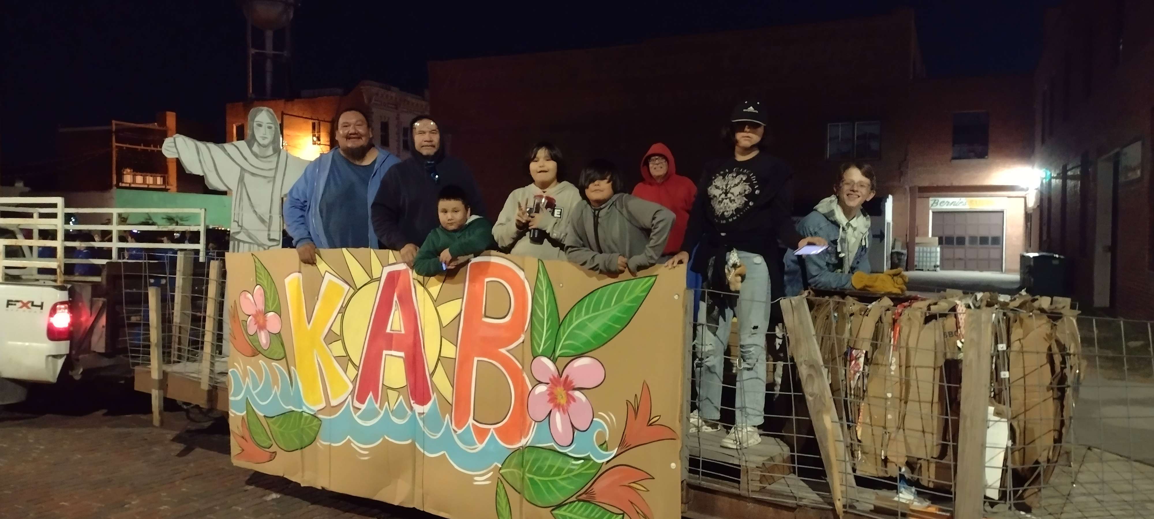 Keep Alliance Beautiful employees and family pose before the float joined the Alliance High School Homecoming Parade Thursday night.