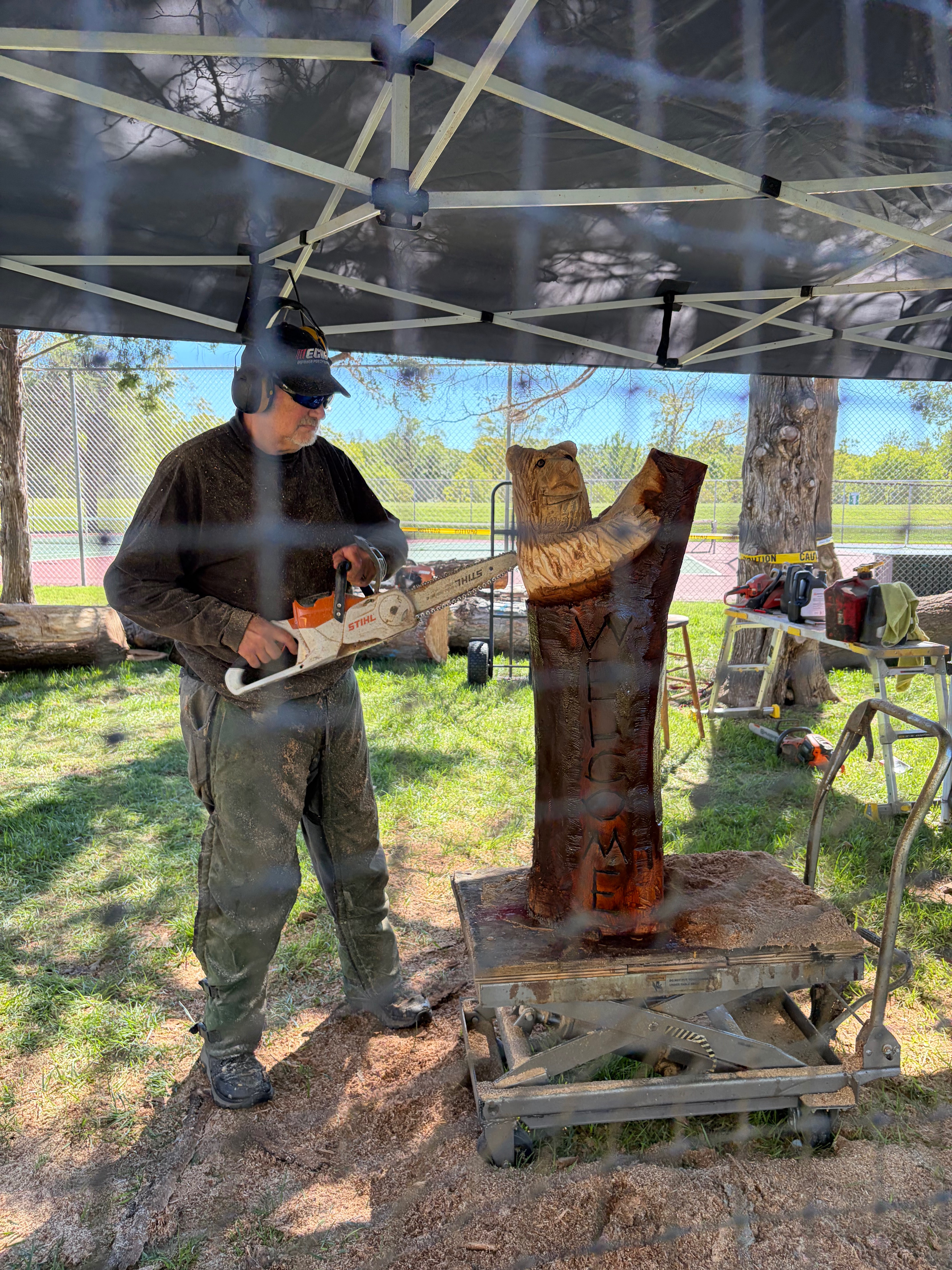 Chainsaw sculpture auction piece being carved at Oktoberfest Hays 2026. Photo by Alin Hett/Hays Post.&nbsp;