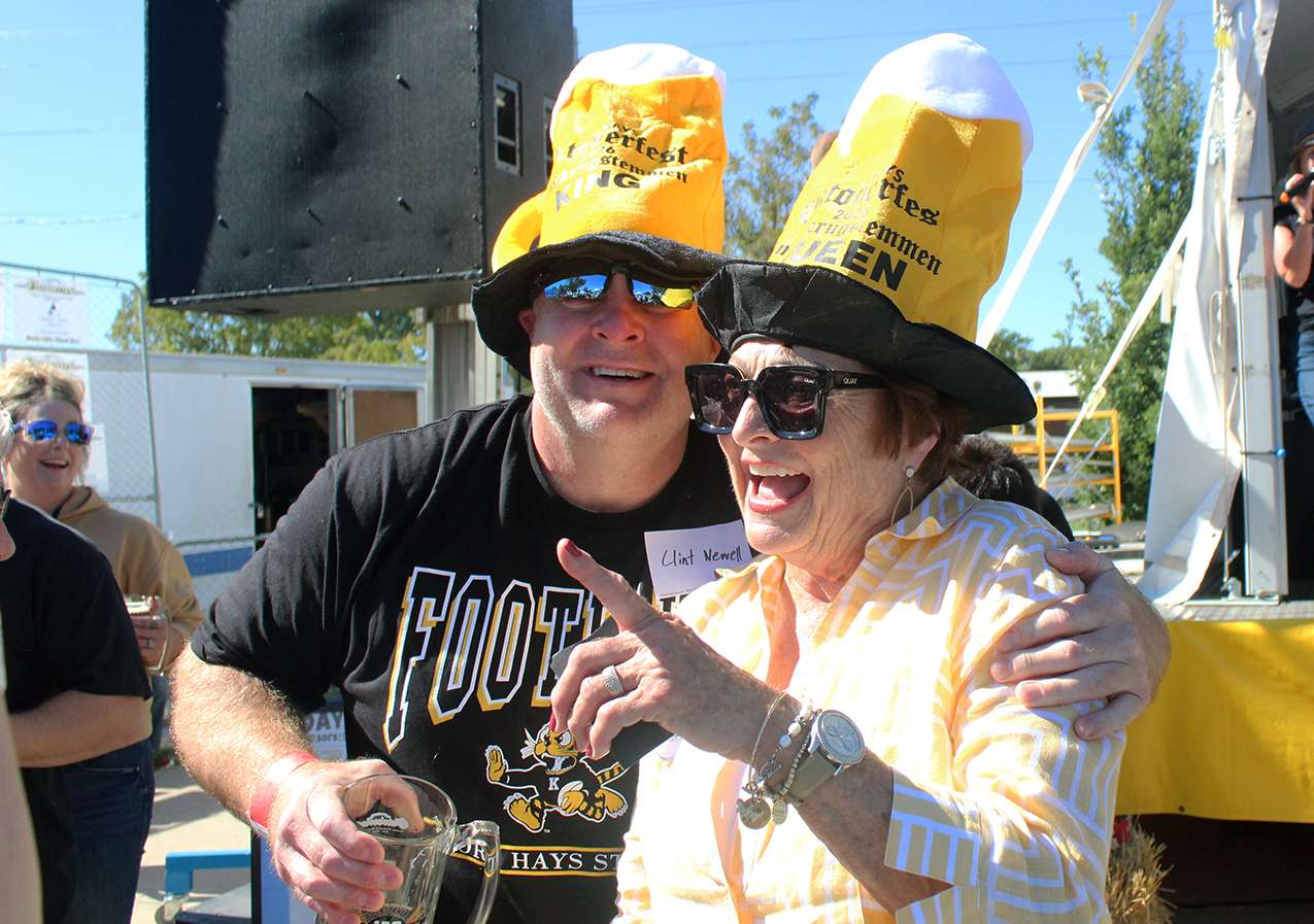 Clint Newell, and his mother, Joyce, hug after the both win their divisions en the Oktoberfest steinholding contest on Friday. Photo by Cristina Janney/Hays Post