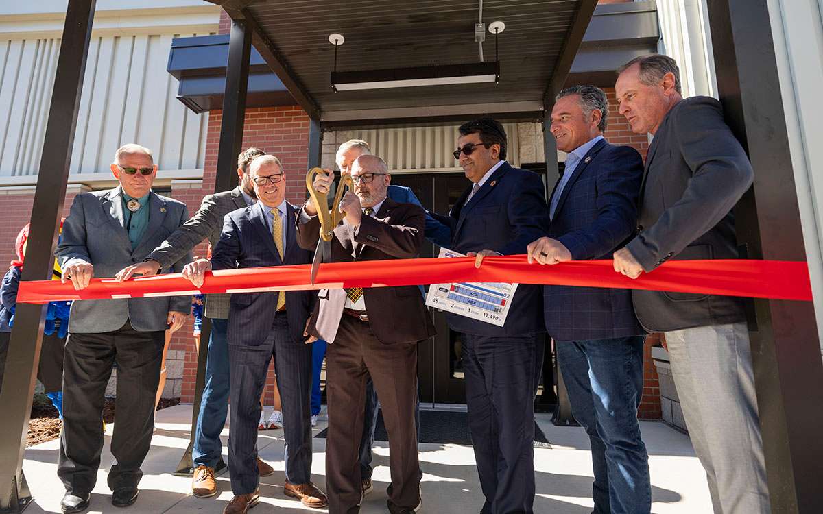 U.S. and state lawmakers, along with KU leaders, participate in a ribbon-cutting for the expansion of the Kansas Law Enforcement Training Center on Oct. 2. (Photo credits: Jeff and Zach Tuttle)
