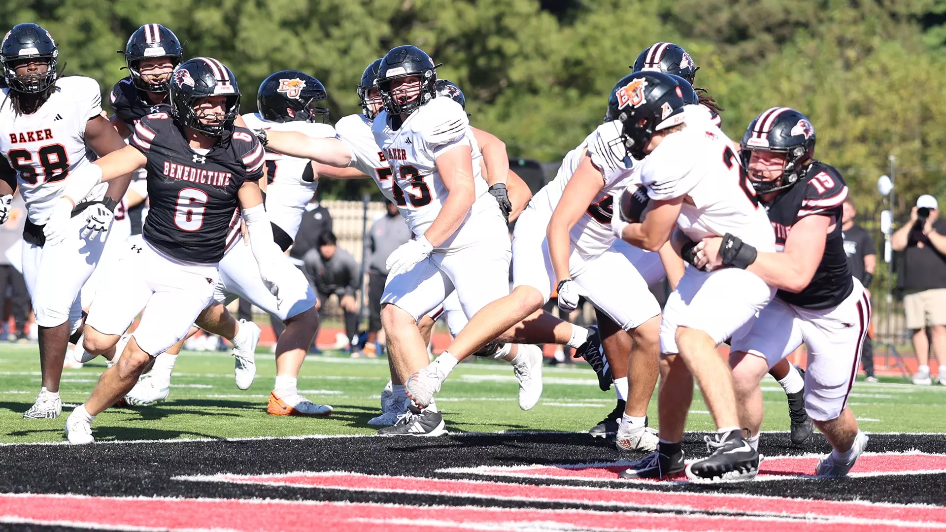Benedictine edge rusher&nbsp;Joseph Abrams (15) tackles Baker running back Gavin Fellingham for what turned into the game winning safety/ Photo courtesy of&nbsp;Elida Murphy-Raven Athletics