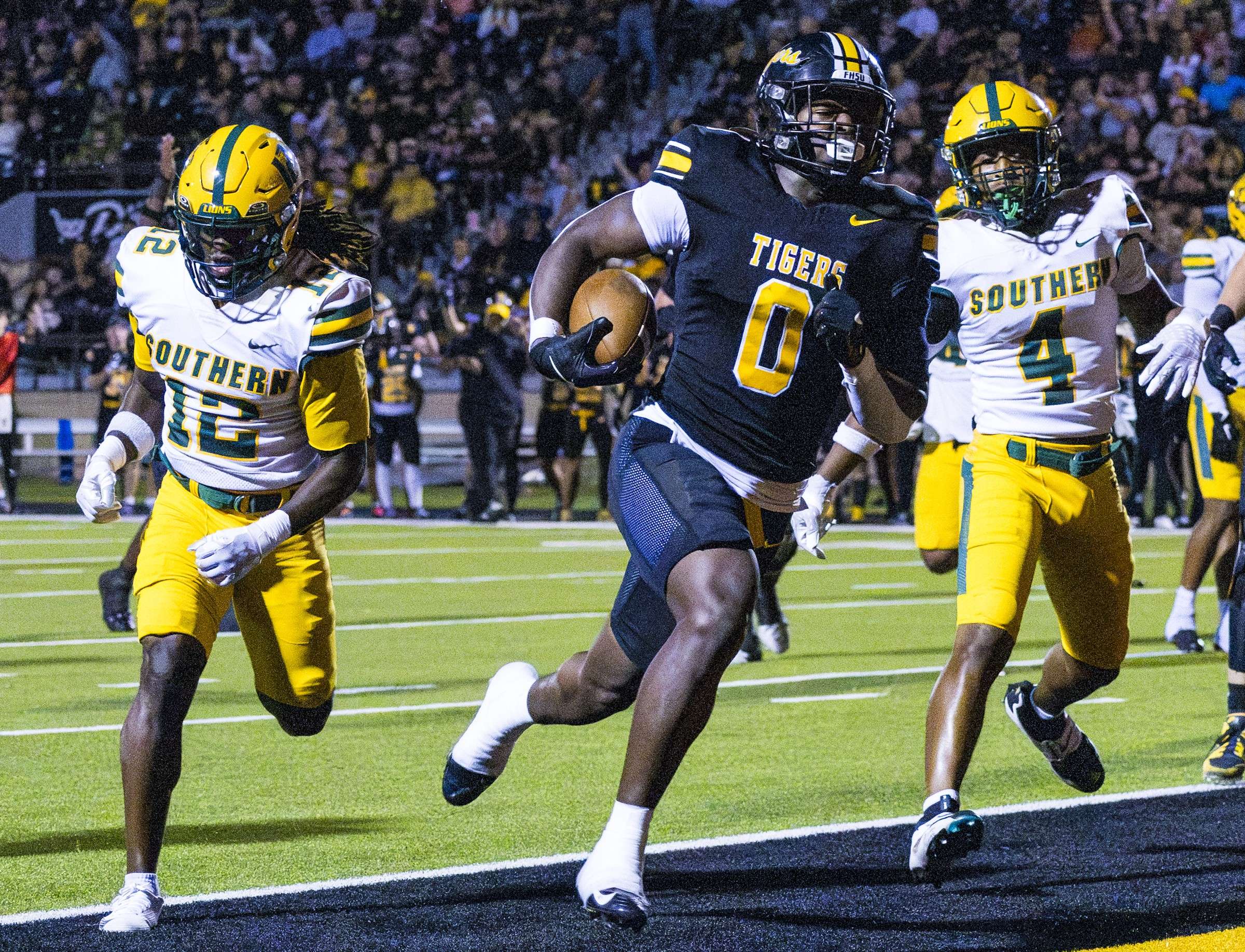 Fort Hays State running back AG Floyd (0) runs past Missouri Southern State's Diamond Casseus (12) and Nyjahl Vaughn (4) for a touchdown in the second quarter of an MIAA football game on on Saturday, October 3, 2026 in Hays, Kan. (Hays Post photo/Jeff Leiker)