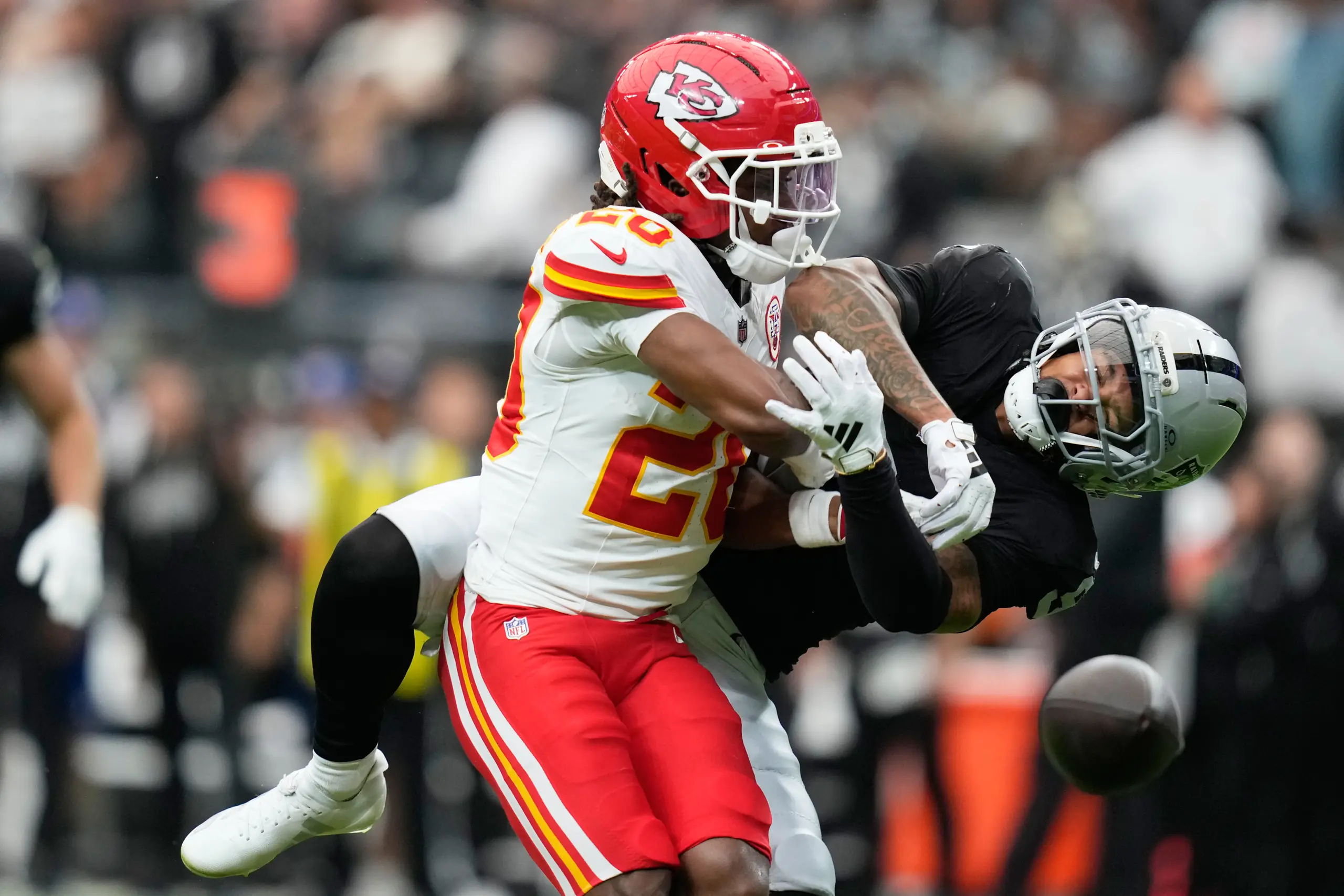 Las Vegas Raiders wide receiver Jalen Nailor, right, can't make a catch as Kansas City Chiefs cornerback Nohl Williams (20) defends during the first half of an NFL football game in Las Vegas, Sunday, Oct. 4, 2026. (AP Photo/John Locher)