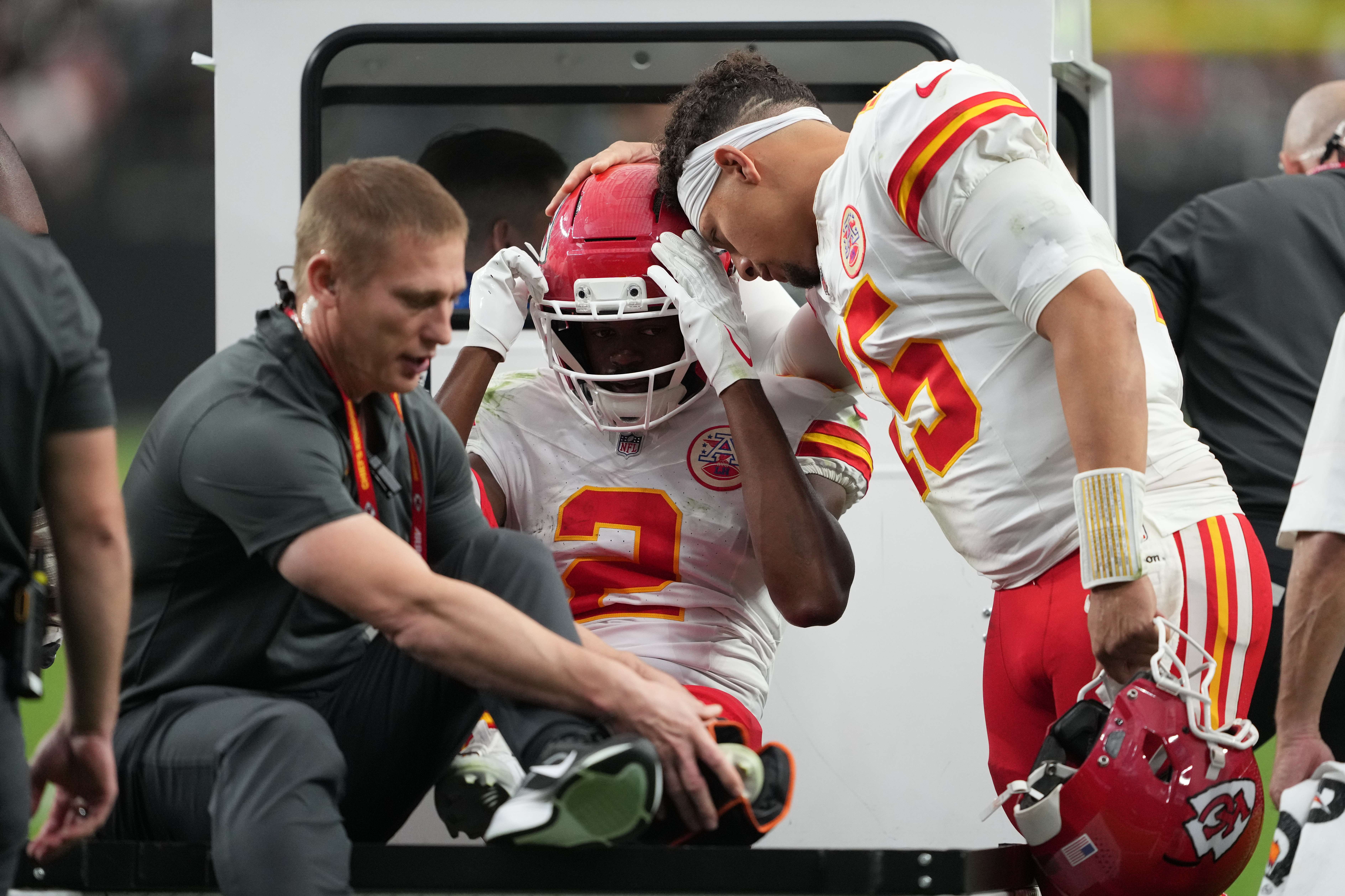 Kansas City Chiefs quarterback Patrick Mahomes (15) talks with wide receiver Tyquan Thornton (2) as he is carted off the field with an injury during the second half of an NFL football game against the Las Vegas Raiders in Las Vegas, Sunday, Oct. 4, 2026. (AP Photo/Rick Scuteri)