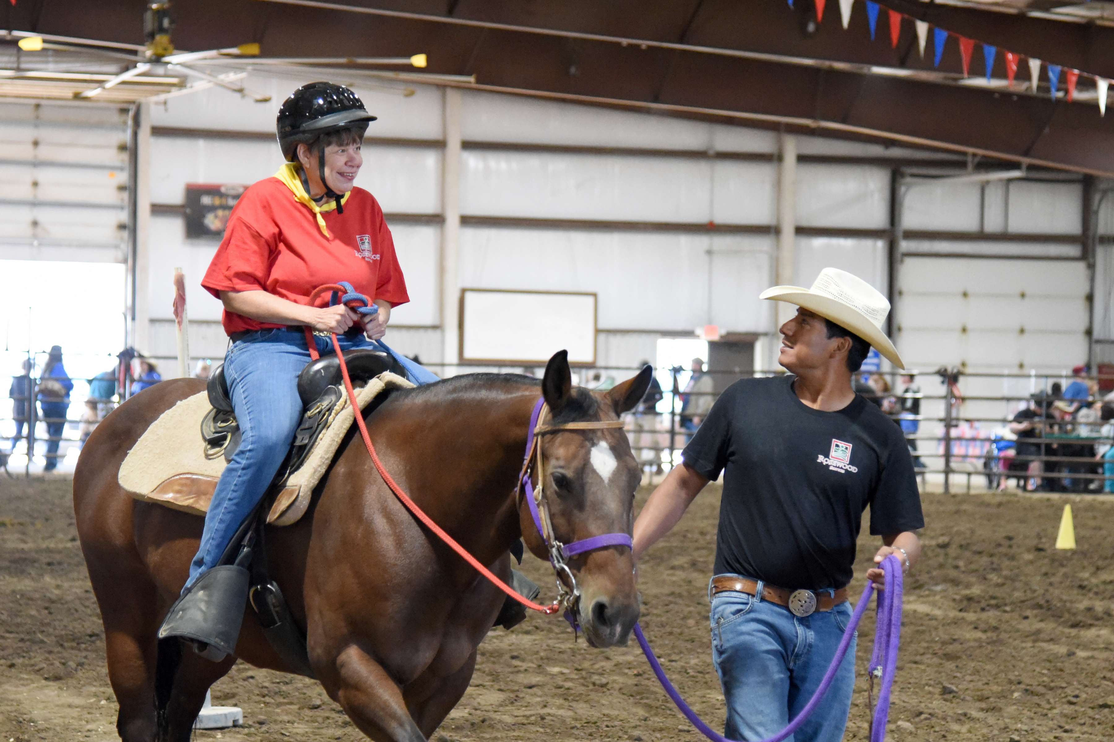 Robin Bethel handles the reins of her horse, “Harriet,” during the Trail Pattern event at Rosewood Rodeo, held at Barton County Fair Grounds Expo III Arena on Oct. 3. She was led by Rosewood Equine Therapy Instructor Juan Bodine. This was Bethel’s 19th Rodeo and she earned “Best Cowboy Spirit” award for her performances this year.