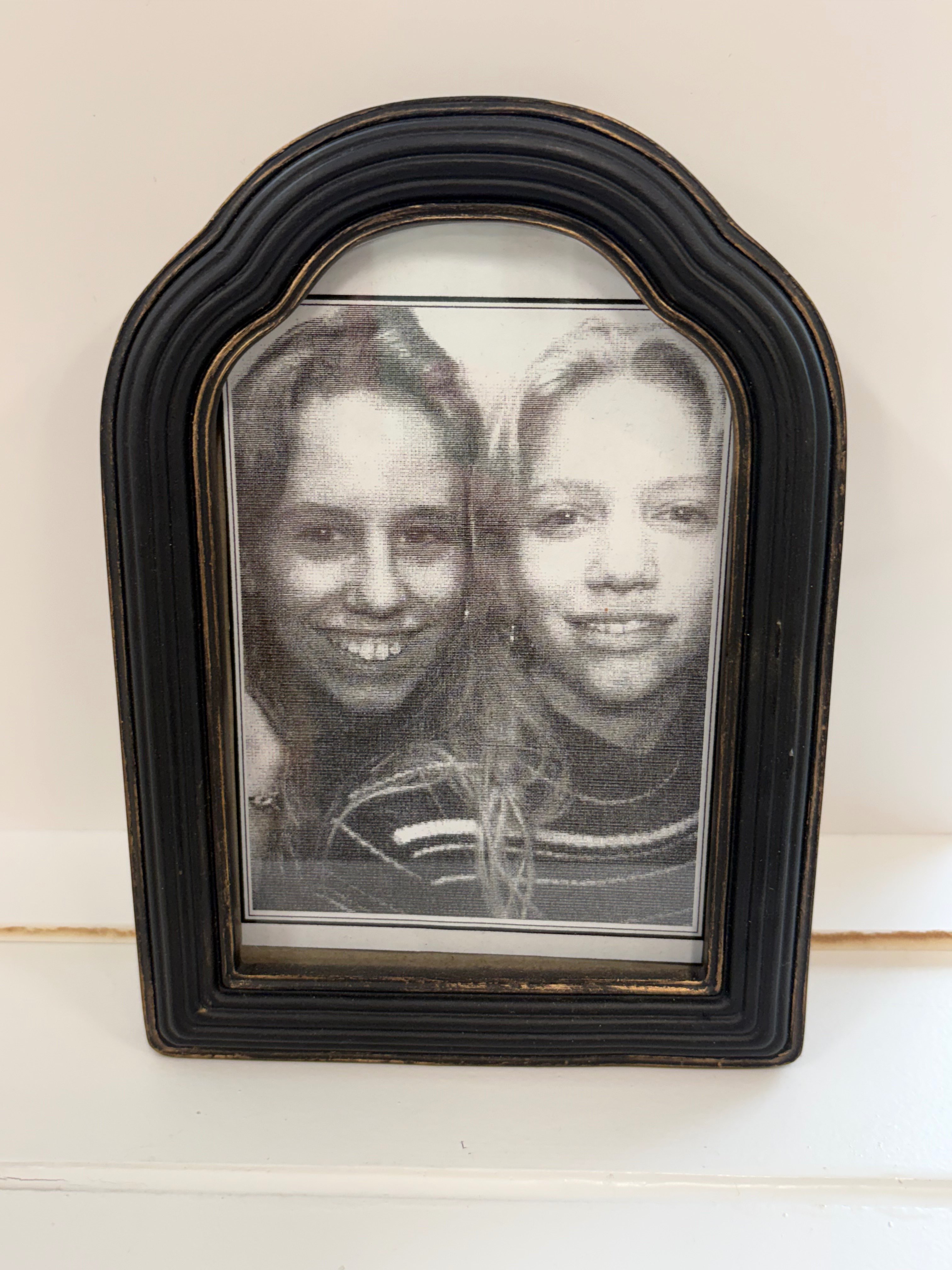 A framed picture inside Salt and Light Salon and Suites showing Brandy Burkholder, left, and Sarah Schaeffer, right, as 10 year olds. Photo by Alin Hett/Hays Post.&nbsp;