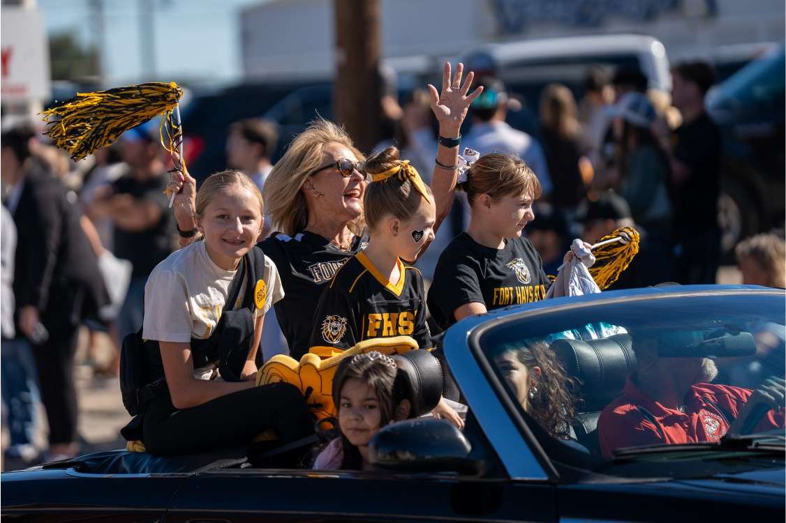 <b>B</b>renda Meder, FHSU Alumni Distinguished Service Award recipient, enjoys riding in the parade with her family. Courtesy Fort Hays State University