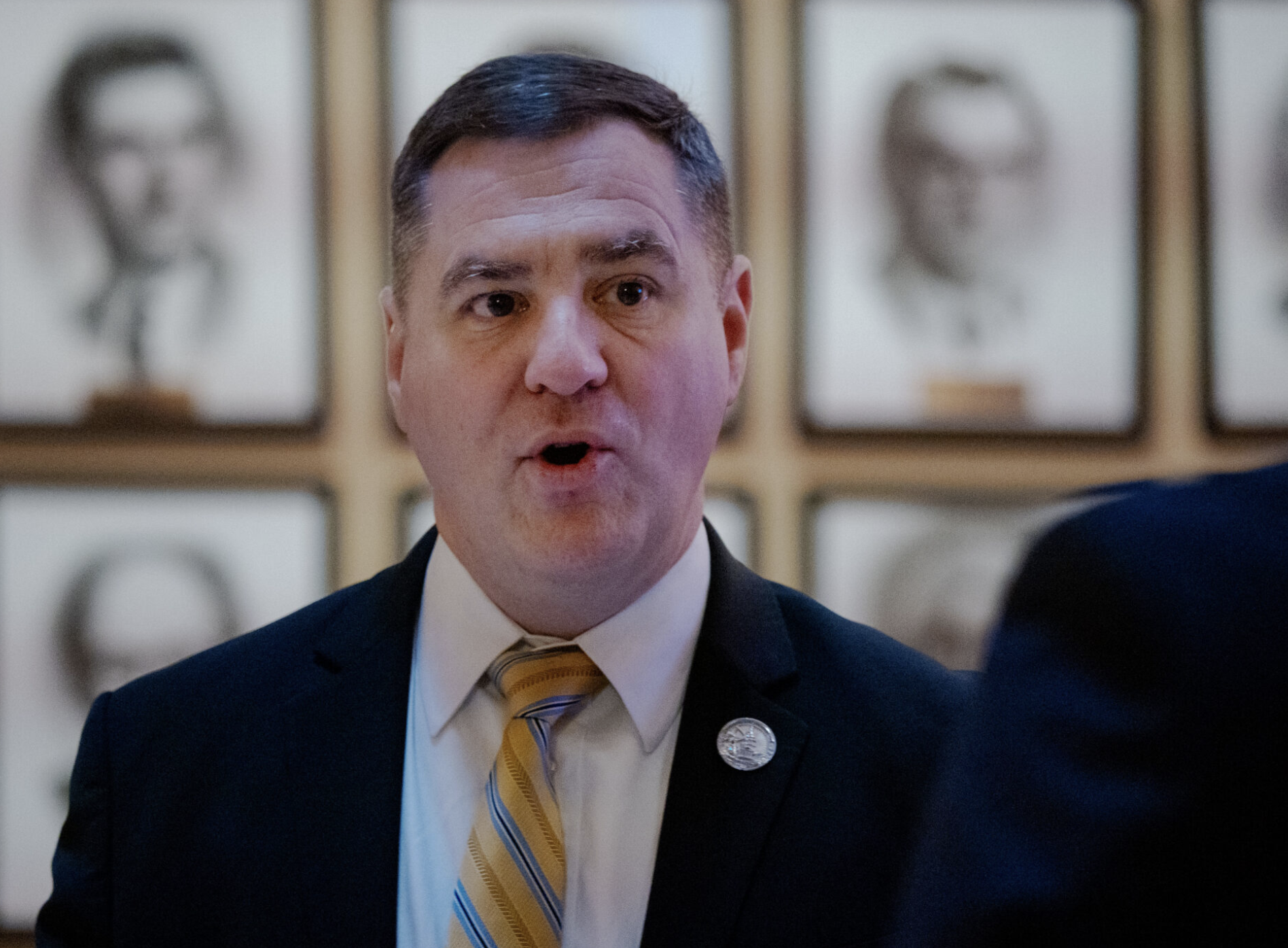  State Rep. Pat Proctor, a Leavenworth Republican running for secretary of state, says a federal agency claimed in 2016 that he owed $93,000 to his restaurant employees for violations of minimum wage and overtime statutes. In this April 9, 2026, photo, Proctor speaks chats at the Kansas Capitol (Photo by Sherman Smith/Kansas Reflector)
