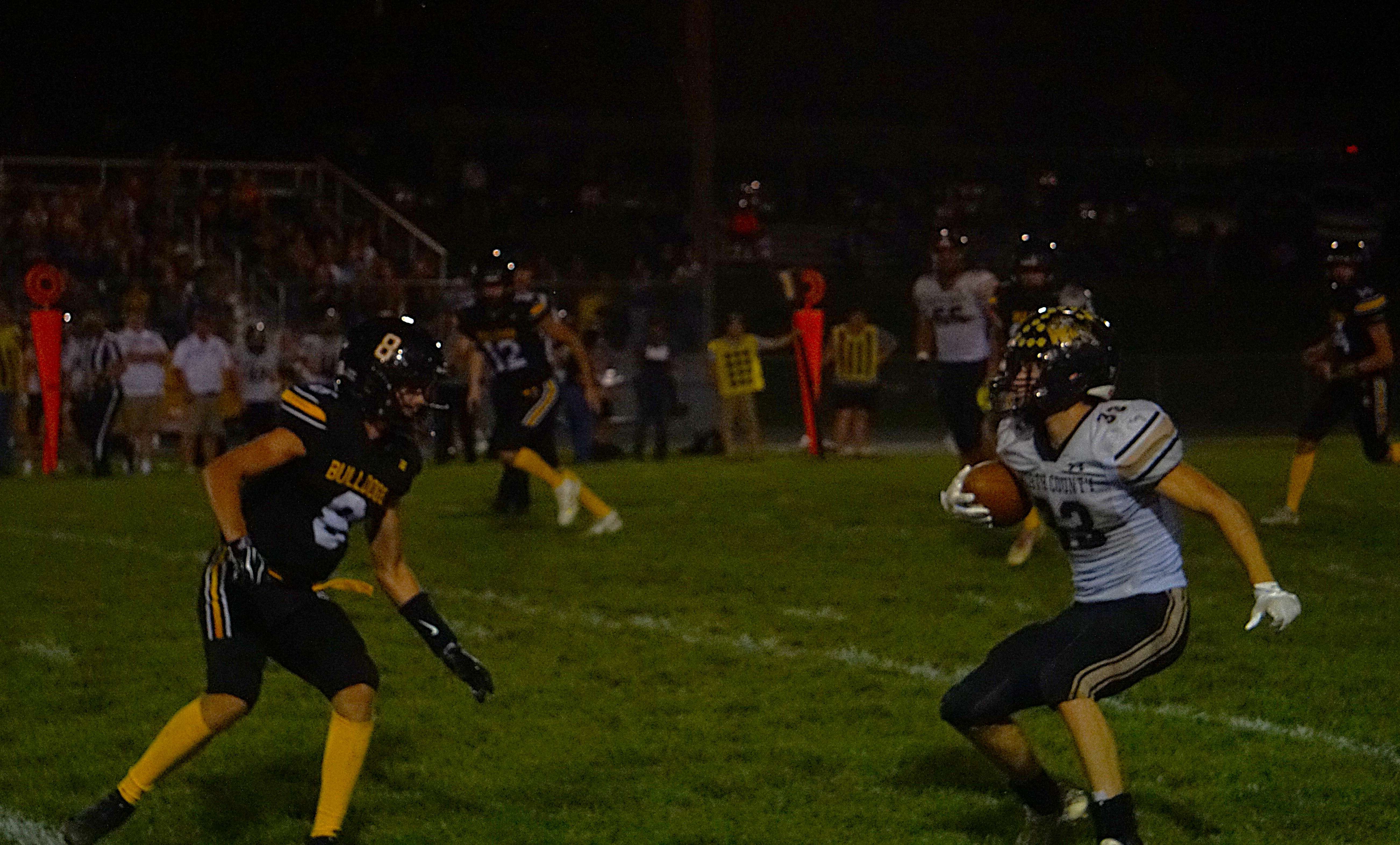 Worth County's Cole Ruby (33) makes a cut around Stanberry's Sam Simbro (8) to rush for a 48 yard touchdown/ Photo by Matt Pike