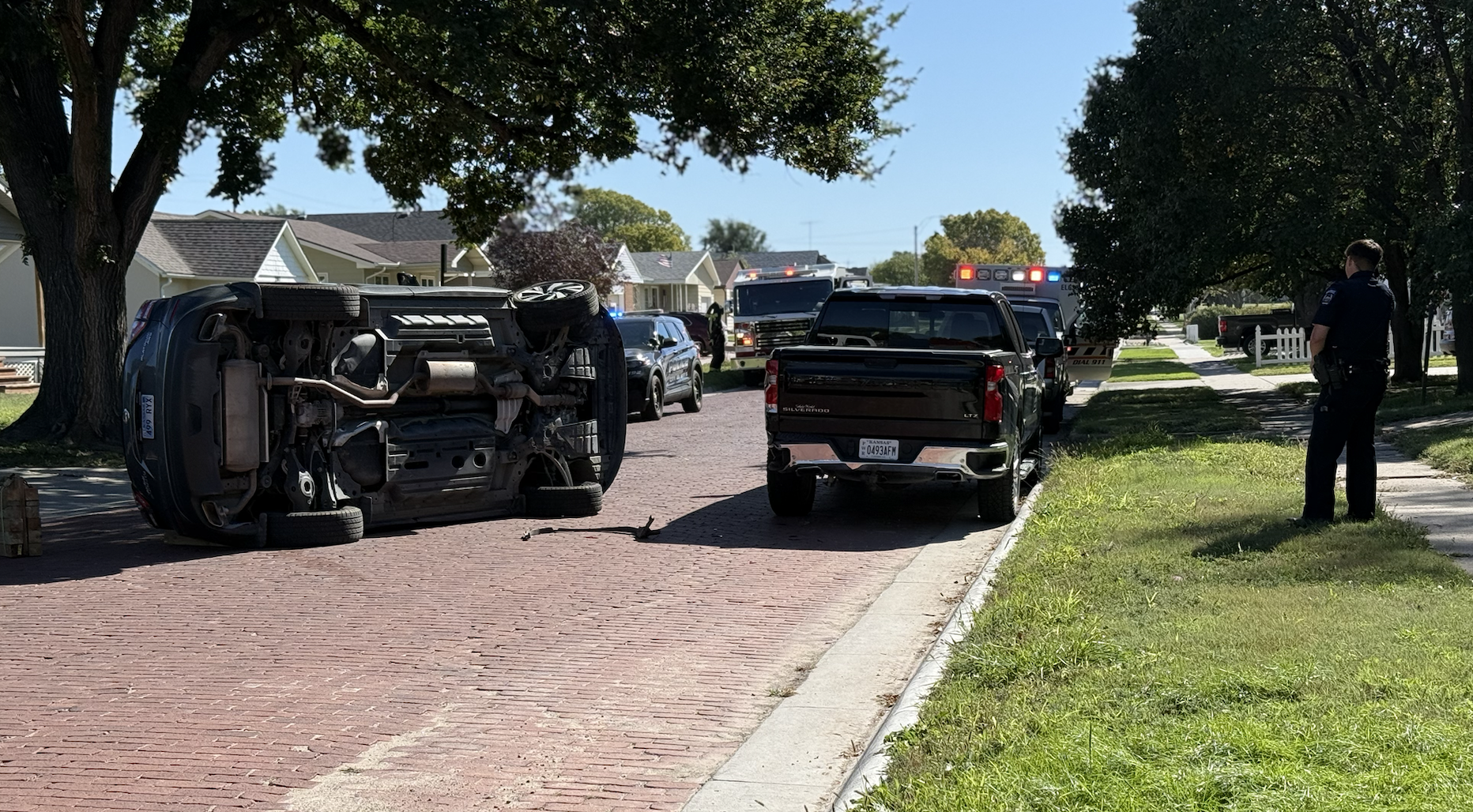 A minivan on its side in the 200 block of East 17th Street. Photo by Cristina Janney/Hays Post