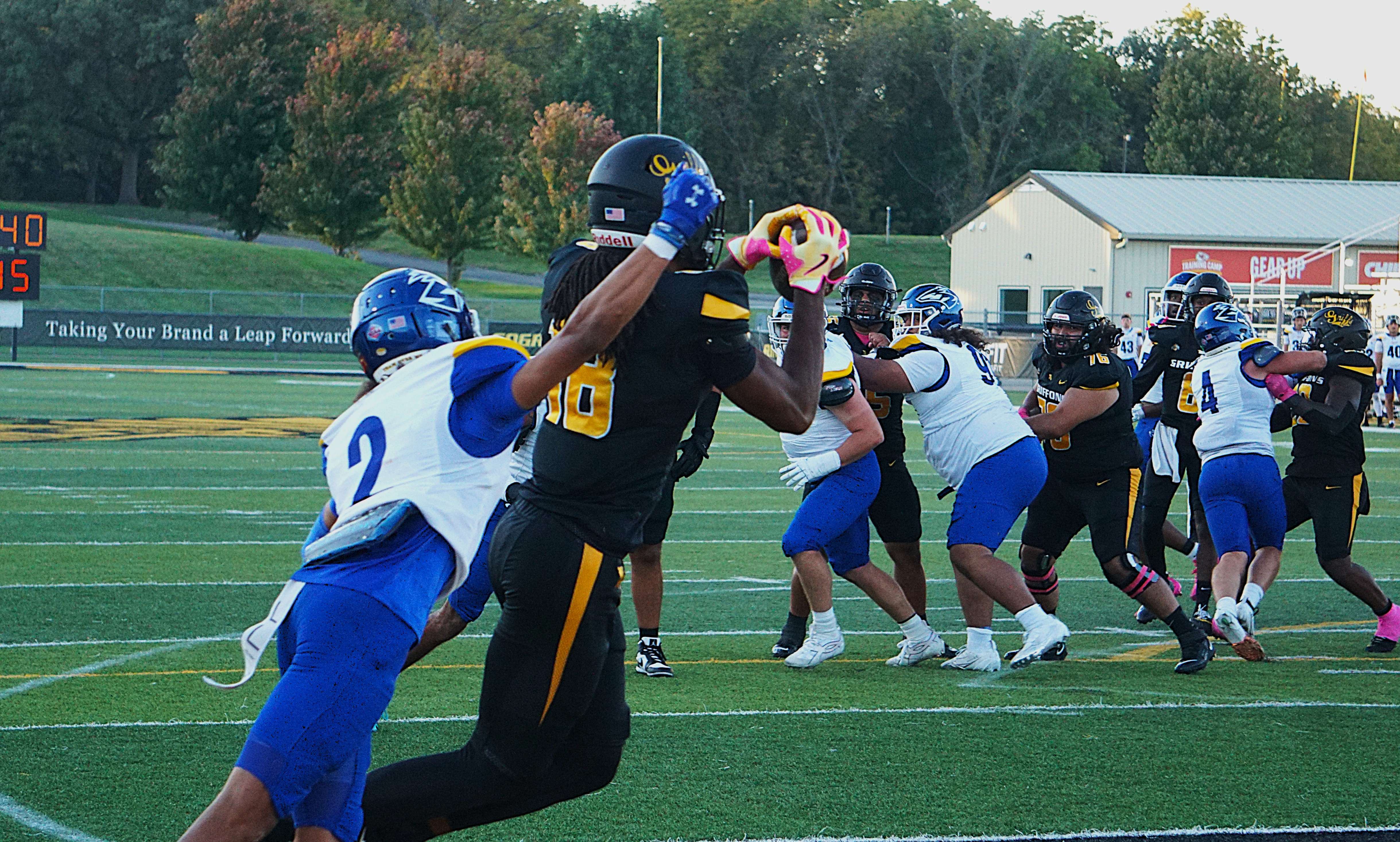 Malik Moore hauls in a touchdown pass from Isaiah Tate to open the scoring/ Photo by Matt Pike