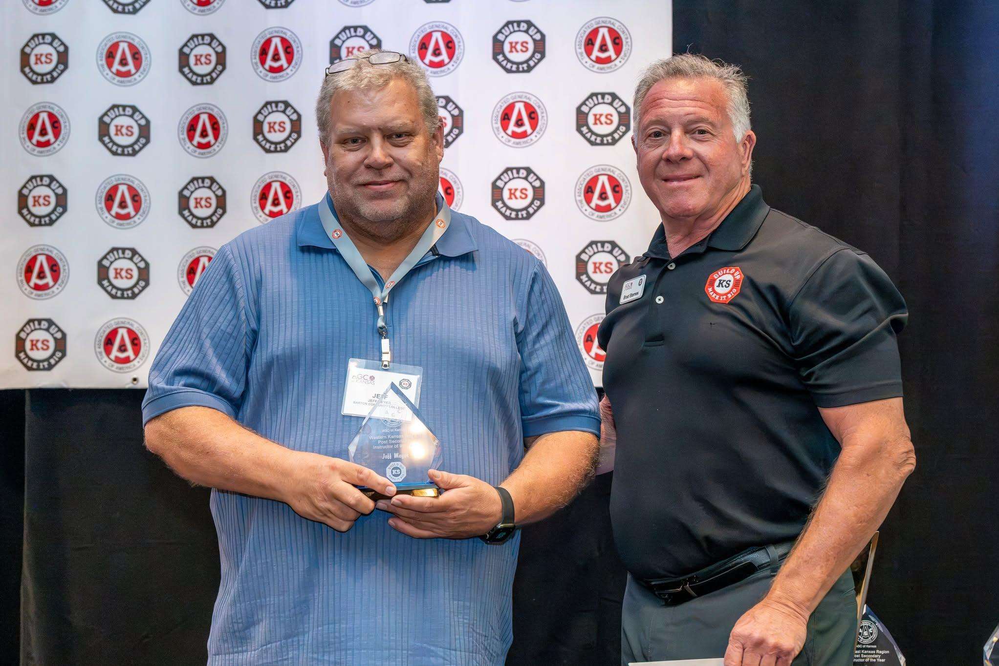 Jeff Meyer (left) accepts his award from Build Up Kansaas Education Coordinator Brad Starnes Oct. 6 at the Associated General Contractors (AGC) of Kansas and Build Up Kansas Instructor Conference in Wichita.