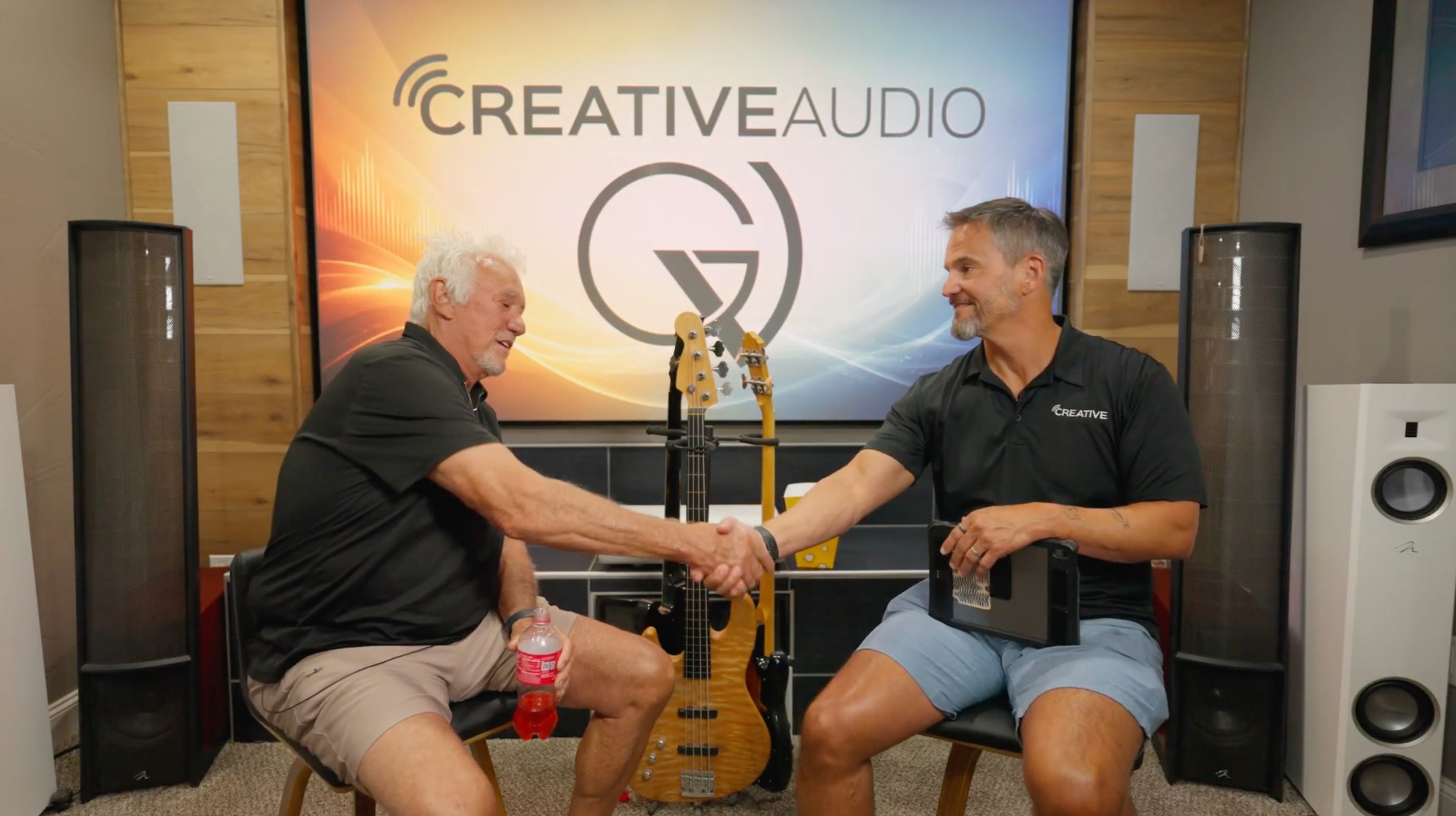 Bill Meyer, left, founder of Good Vibrations in Hutchinson, shakes hands with Creative Audio owner Don Fleury during an interview discussing the company's acquisition and Meyer's retirement after 42 years in business. Good Vibrations will transition to the Creative Audio name, with Meyer's son, Mitch, serving as store manager. (Courtesy photo)