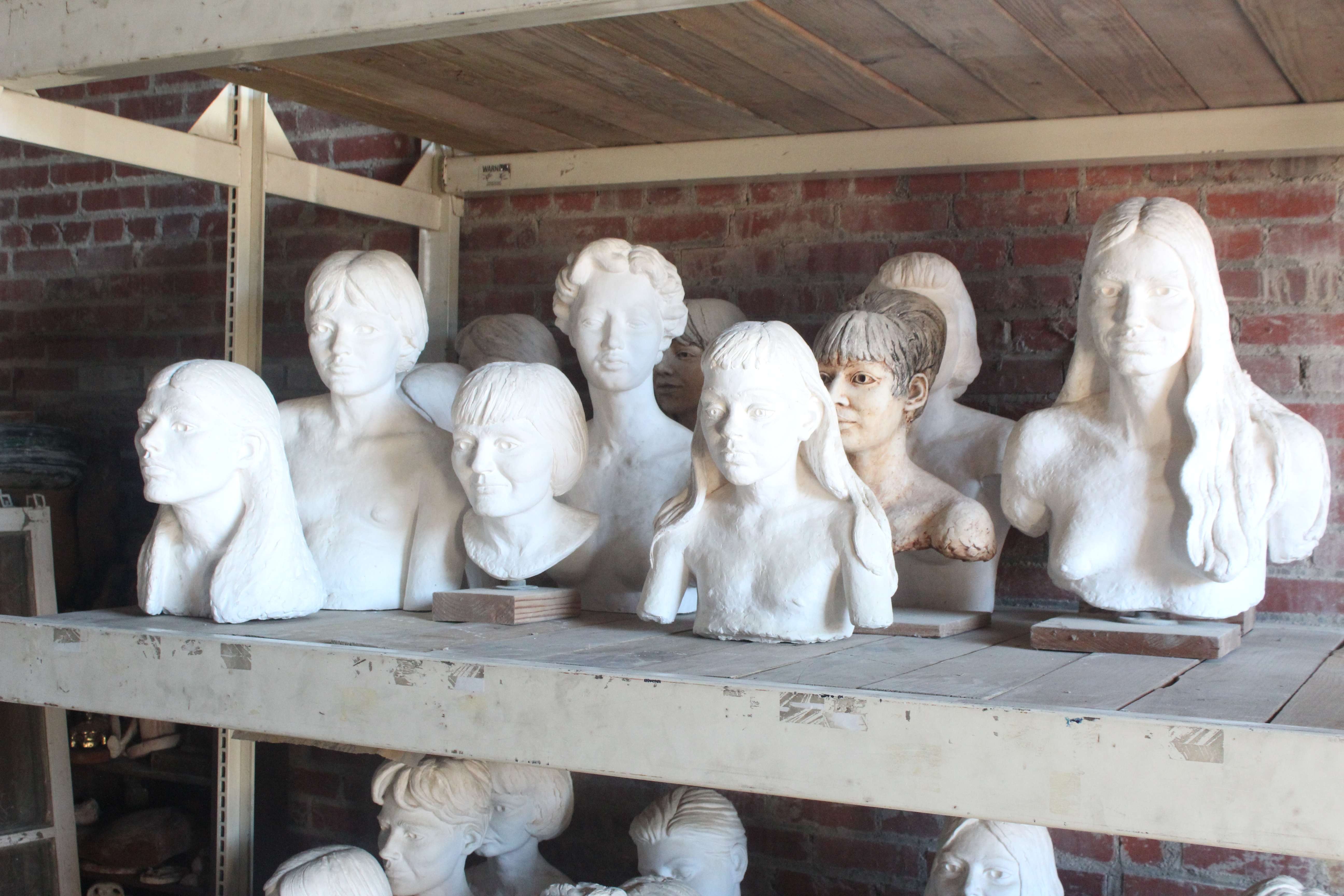 Busts by artist Pete Felten that are being stored in his shed. The shed's roof is leaking and donations are needed to fix it. Photo by Cristina Janney/Hays Post