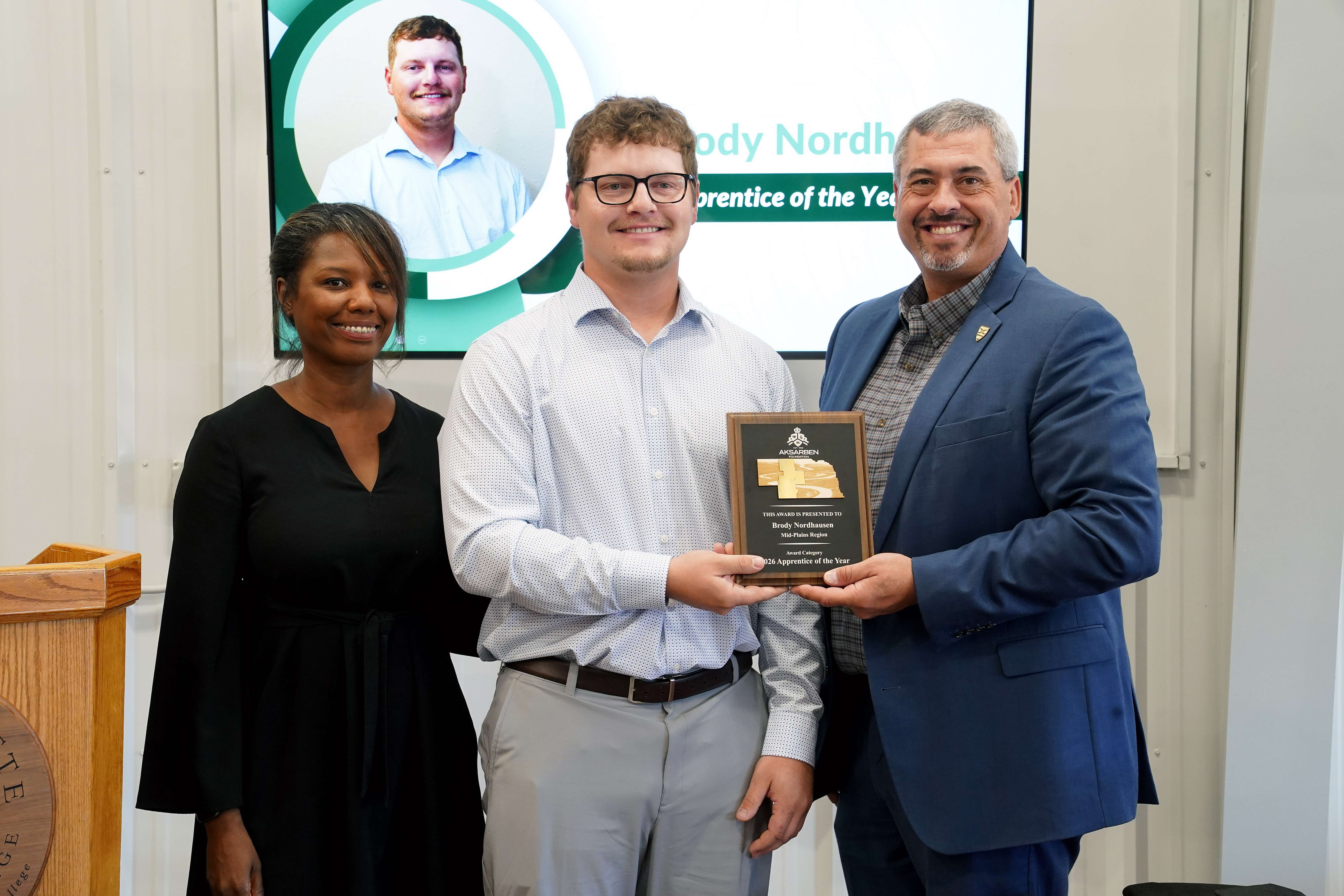 Shonna Dorsey with Aksarben Foundation (left) and MPCC President Ryan Purdy present Brody Nordhausen (center) with the Apprentice of the Year award Monday during the 2026 Nebraska Emerging Talent Awards – Mid-Plains Region event in North Platte. (Courtesy MPCC)