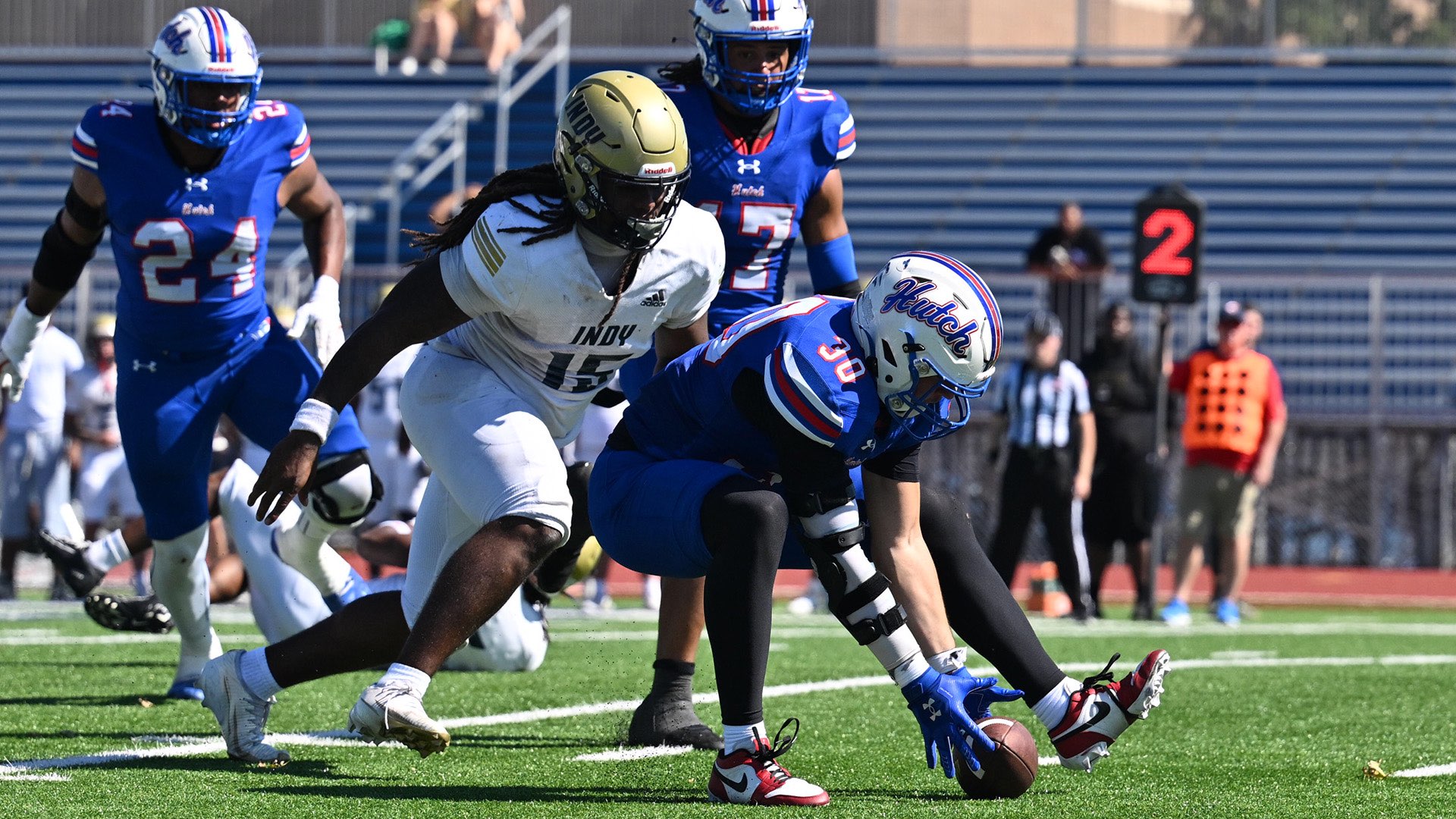 Jack Sells picks up a fumble and returns it to the Independence 1 in the top-ranked Blue Dragons' 72-0 win over the Pirates on Saturday at Gowans Stadium. (Andrew Carpenter/Digital Fox Photography)