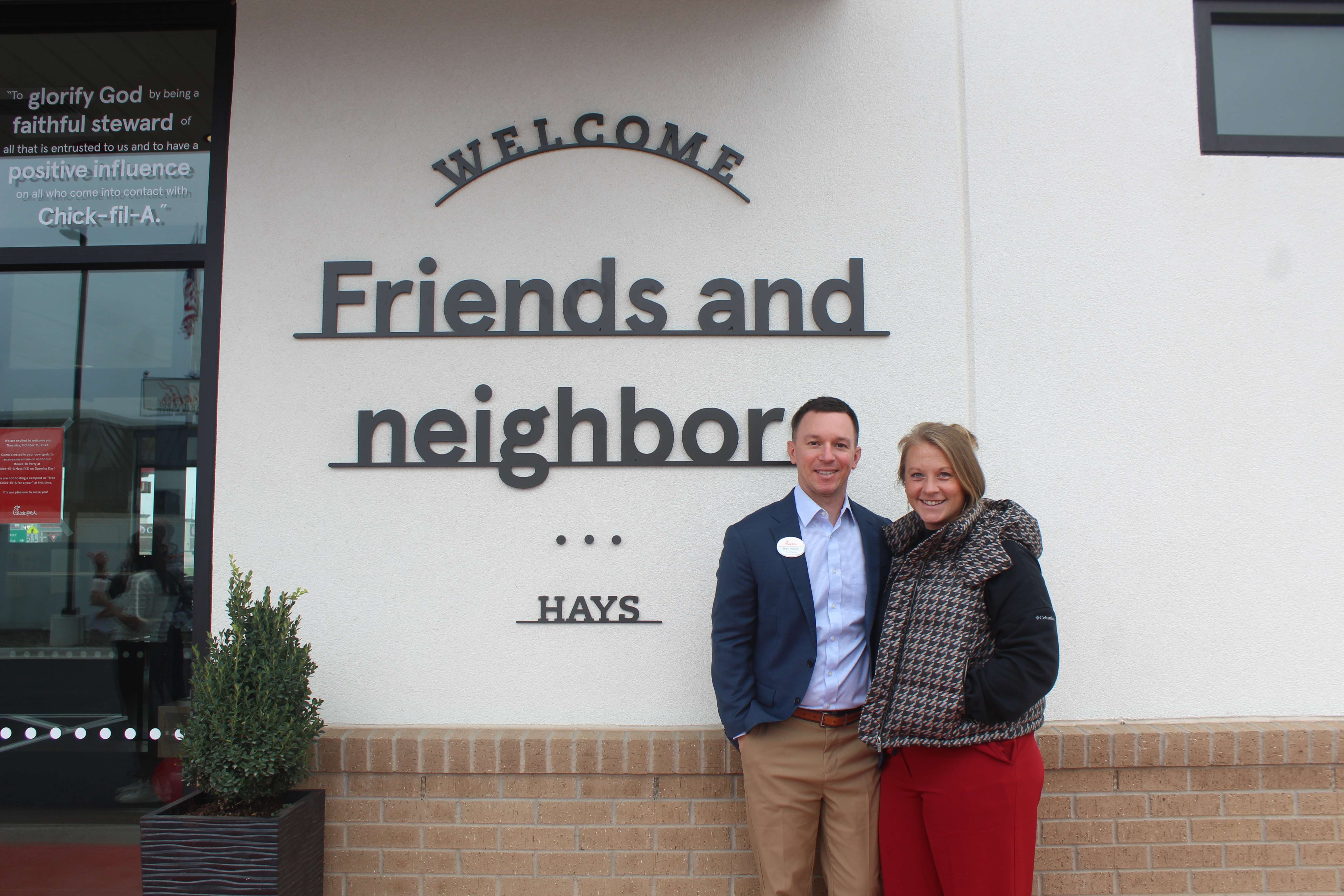 Hays Chick-fil-A owner-operator Brett Pennell and his wife, Sarah, outside the store on Wednesday. The couple and their two children recently moved to Hays. Photo by Cristina Janney/Hays Post