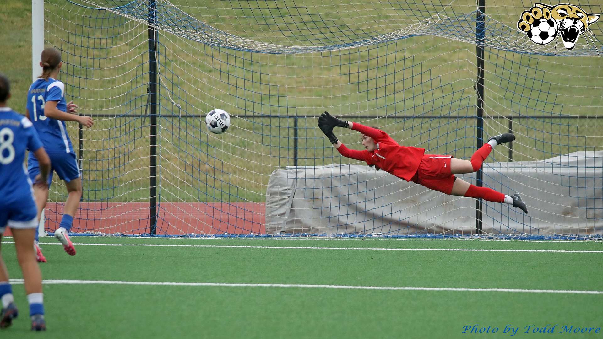 Barton women's soccer goalkeeper Lucie Gillig dives for a save versus Dodge City (BartonSports.com)