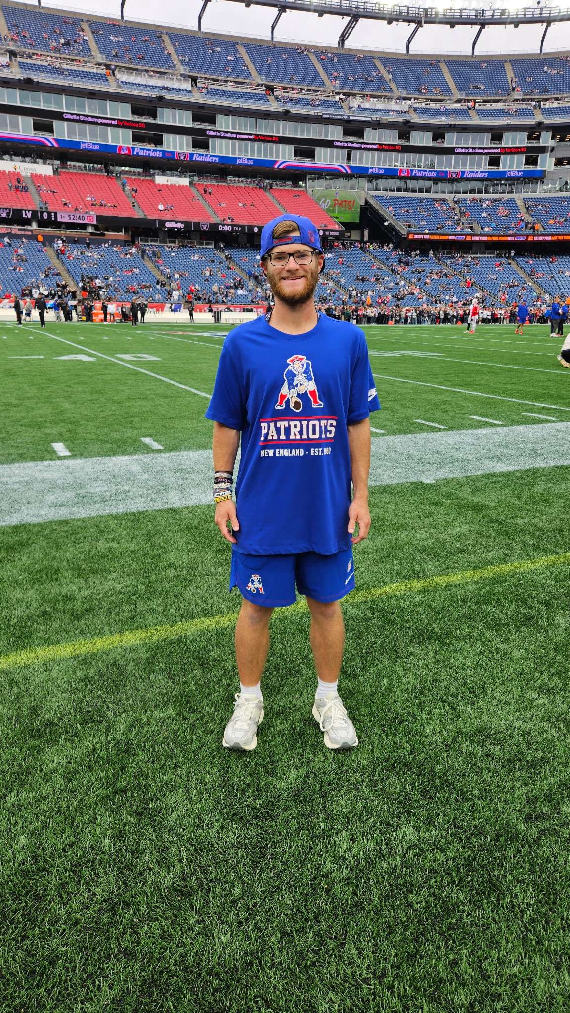Haven native Garrett Reihs poses on the field at Gillette Stadium in Foxborough, Massachusetts, before the New England Patriots' game against the Las Vegas Raiders on Oct. 11, 2026. The 24-year-old Reno County native is in his first full season as a seasonal equipment manager with the Patriots. (Courtesy photo)