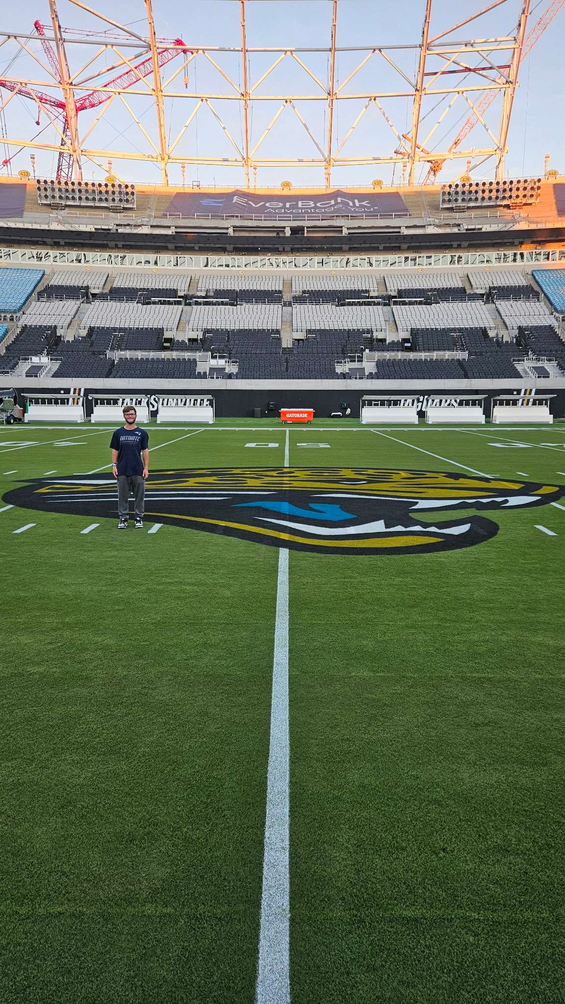Garrett Reihs, a Haven native and seasonal equipment manager for the New England Patriots, stands at midfield at EverBank Stadium in Jacksonville, Florida, before New England's game against the Jacksonville Jaguars on Sept. 27, 2026. Reihs previously worked on the equipment staff at Kansas State University for three seasons. (Courtesy photo)