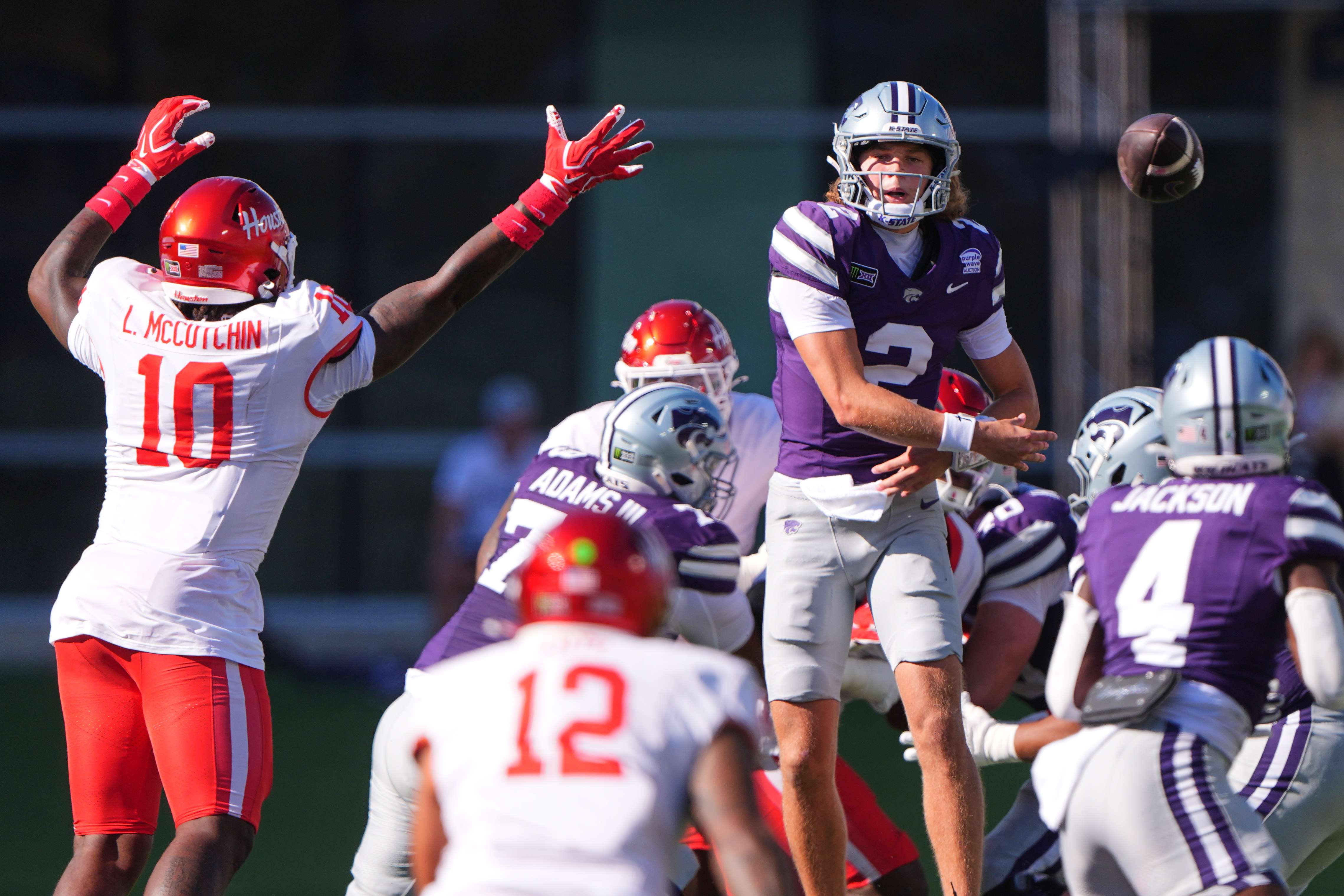 Kansas State quarterback Avery Johnson (2) passes during the first half of an NCAA college football game against Houston, Saturday, Oct. 10, 2026, in Manhattan, Kan. (AP Photo/Charlie Riedel)