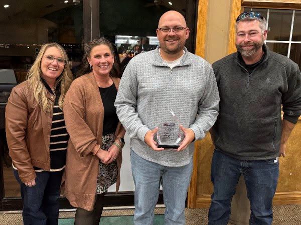 Keith County Chamber of Commerce representatives celebrate the Ogallala Indian Summer Rendezvous being named the Nebraska Chambers Association’s 2026 Event of the Year. Tourism Director Shawn Rubek holds the award alongside Chamber staff and board members. (Image Keith County Chamber)