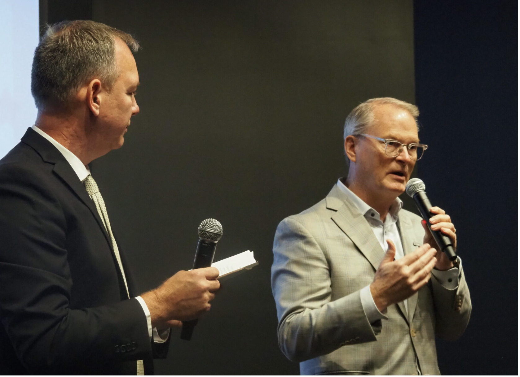 U.S. Sen. Roger Marshall, R-Kansas, discounts the experience of a Meriden businessman’s concern that global demand for U.S. products was diminished by President Donald Trump’s tariffs during a candidate forum Oct. 16, 2026, at Great Overland Station in Topeka. Marshall is in a tight reelection campaign with Democrat Adam Hamilton. (Photo by Tim Carpenter/Kansas Reflector)