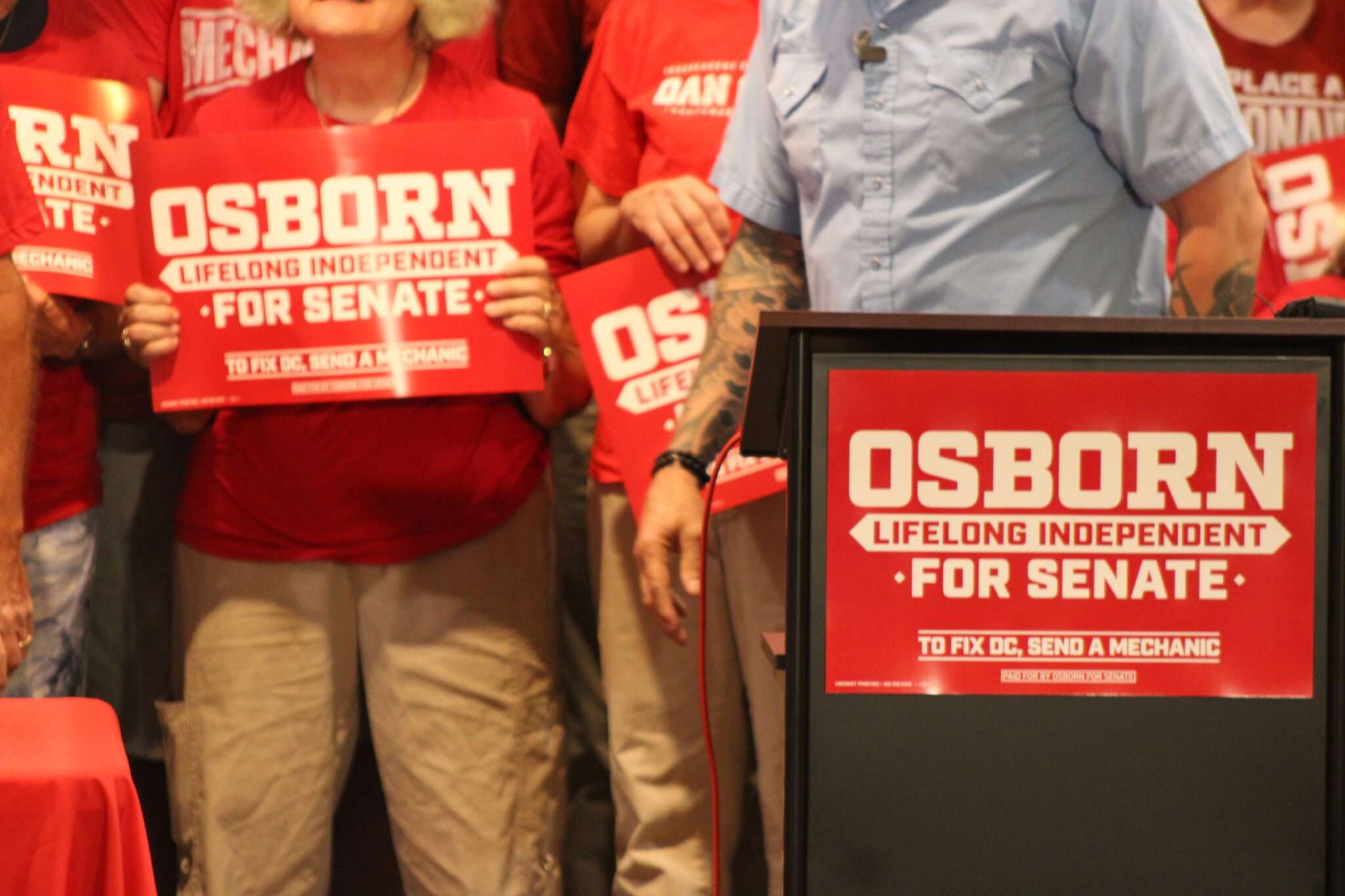  Registered nonpartisan U.S. Senate candidate Dan Osborn leaves a podium in Lincoln on June 11, 2026. (Juan Salinas II/Nebraska Examiner)