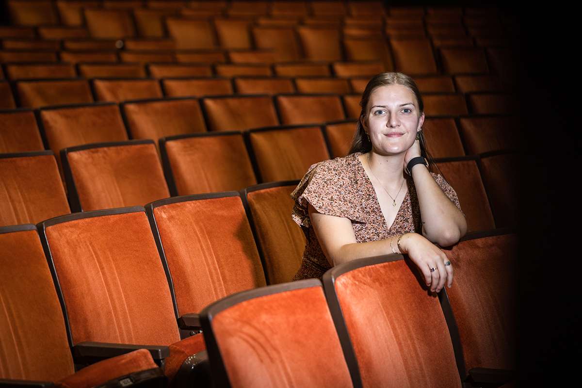 Maddie Fenimore is pictured inside the Charles Johnson Theater at the Olive DeLuce Fine Arts Building/ Photo by Lilly Cook-Northwest Missouri State University
